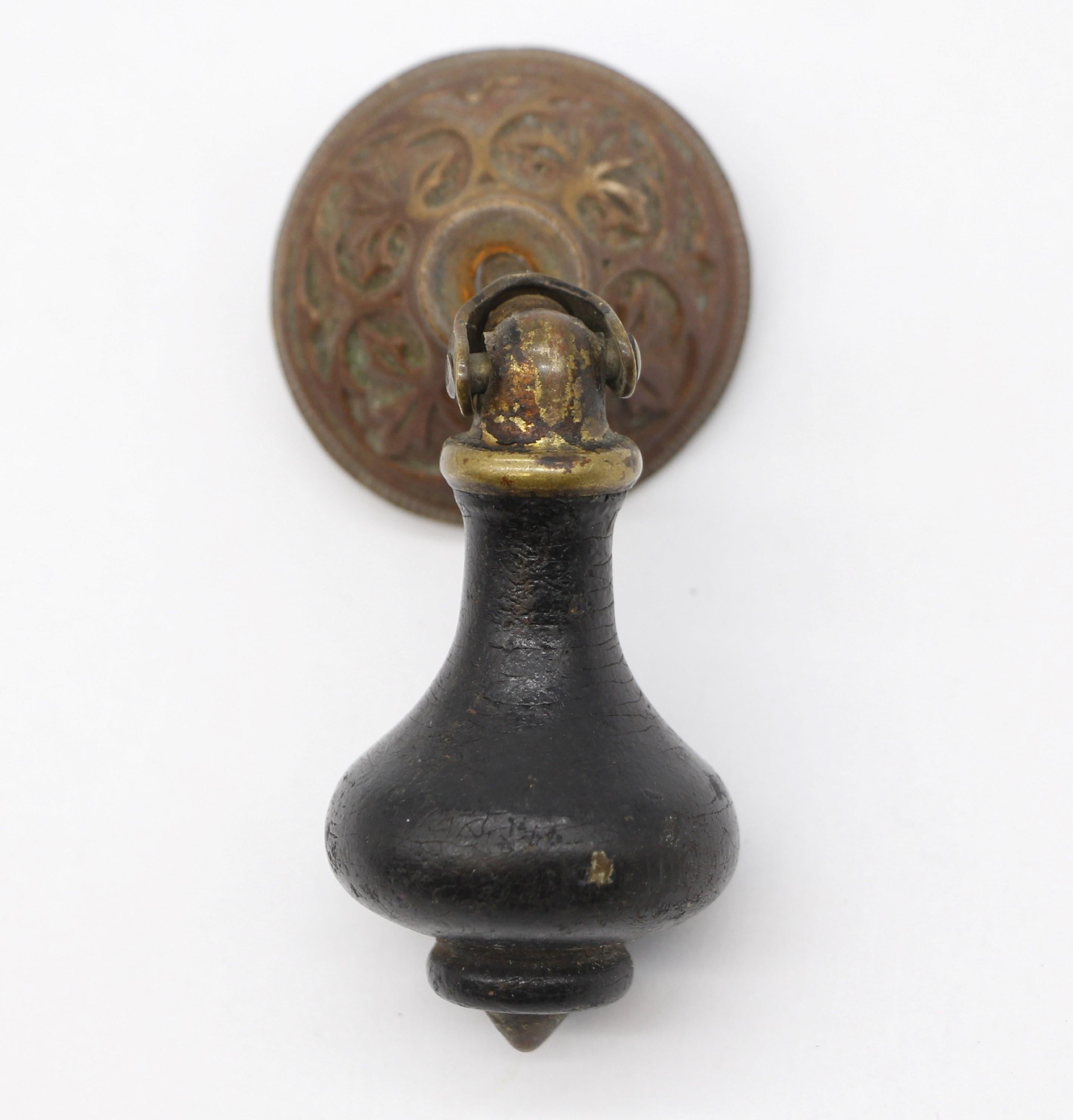Late 19th century pair drawer pulls. Done in a tear drop style. Made from brass and wood in a black finish. Priced as a pair. Please note, this item is located in our Scranton, PA location.