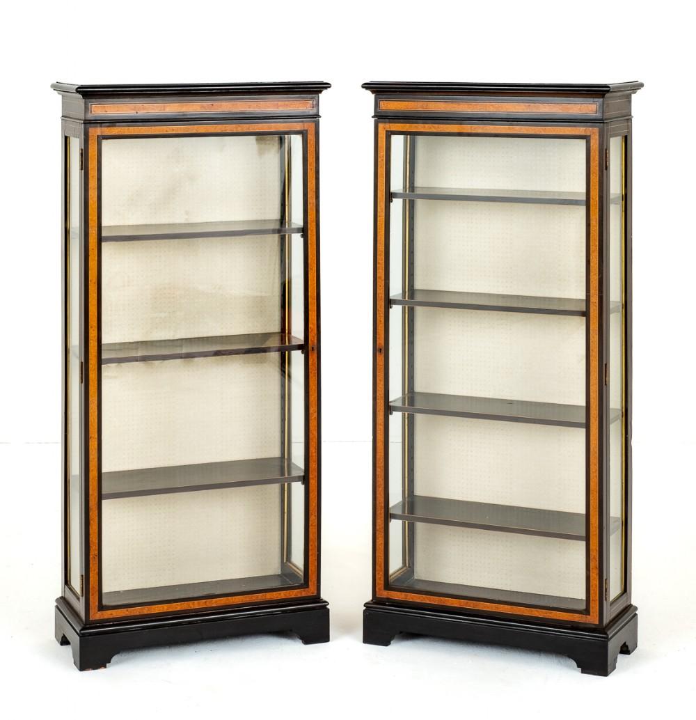 Pair of Victorian Walnut and Ebonised Display Cabinets.
Circa 1860
These Matched Pair of Cabinets Stand upon Bracket Feet.
Each Cabinet Having 1 Single Door which Open to Reveal 4 Shelves.
The Doors and The Frieze Featuring the Very Best Burr Walnut
