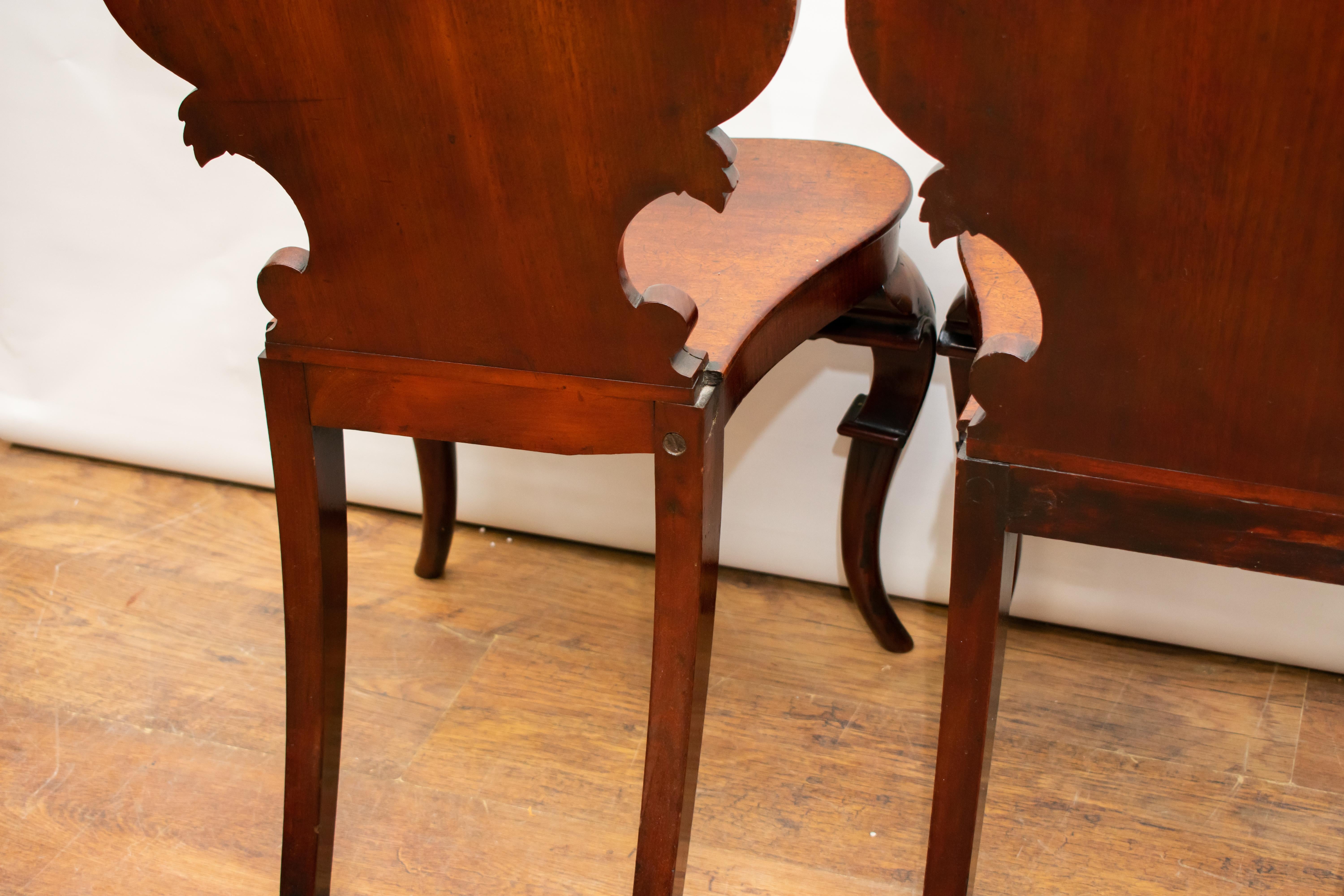- Gorgeous pair of Victorian hall chairs
- Hand carved and in mahogany, circa 1840 
- Great collectors pair
- Offered in great shape, ready for home use right away
- Will ship to anywhere in the world.

 