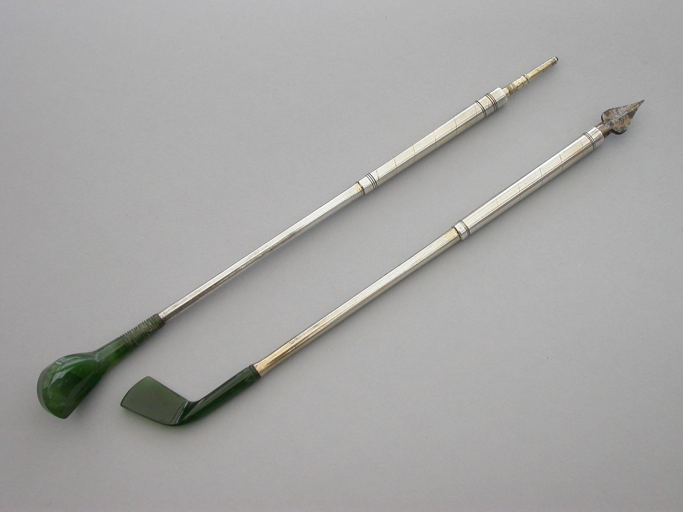 A good quality late Victorian or early 20th century pair of novelty silver mounted nephrite propelling pencil and dip pen, made in the form of Golf Clubs (a driver and a long iron). Realistically modeled and carved, the propelling pencil extending