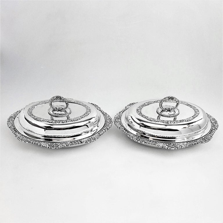 A pair of beautiful Victorian solid Silver Entree Dishes in a classic oval form. These Entree Dishes are of particularly good weight and quality. The bases have impressive shell & gadroon borders on the rim and the lids feature a matching applied