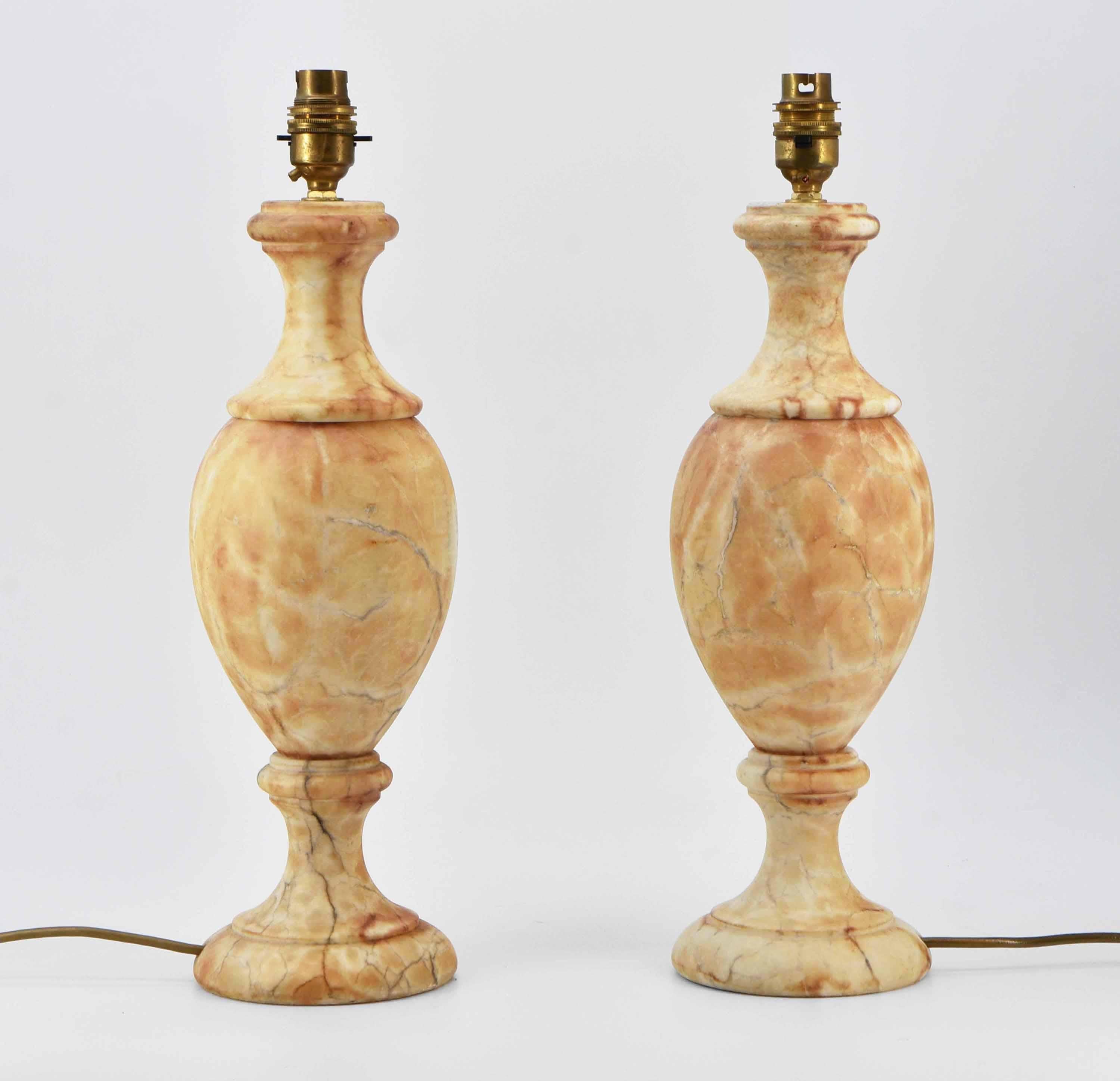 A pair of vintage alabaster Neoclassical style table lamps with wonderful figuring. Circa 1980. 

Free UK delivery via a selected parcel company. 

The electrics have been PAT tested, a new gold cable has been added to one. The cable lengths are