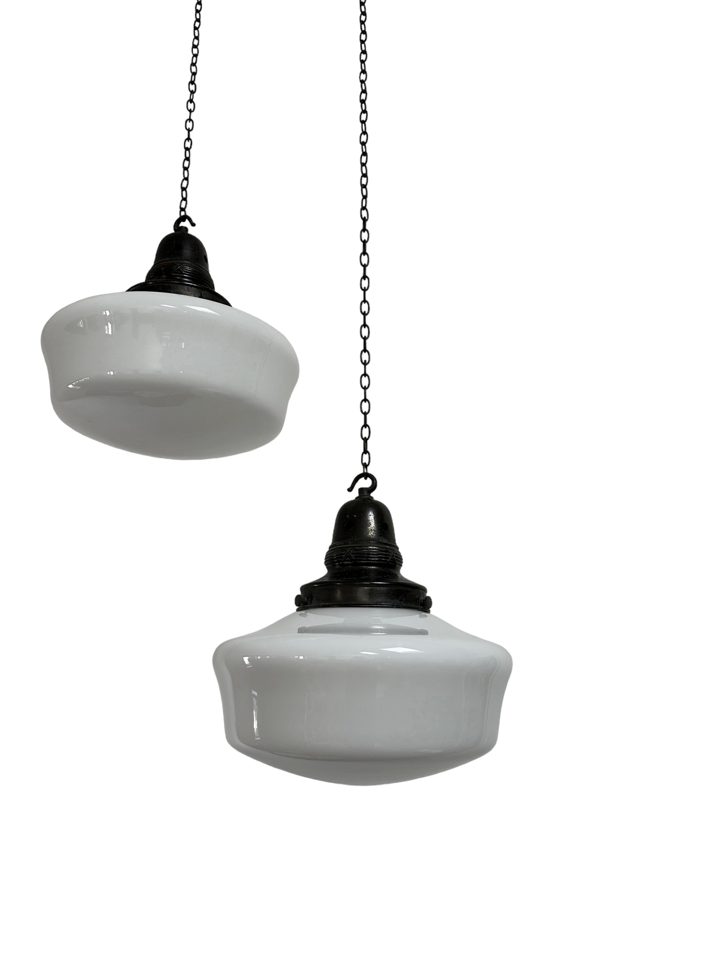 - A fabulous pair of original church opaline glass pendant lights with patinated copper galleries, circa 1930.
- Wear commensurate with age, all in a good condition, the copper galleries are aged worn.
- Rewired with braided flex and PAT tested.
-
