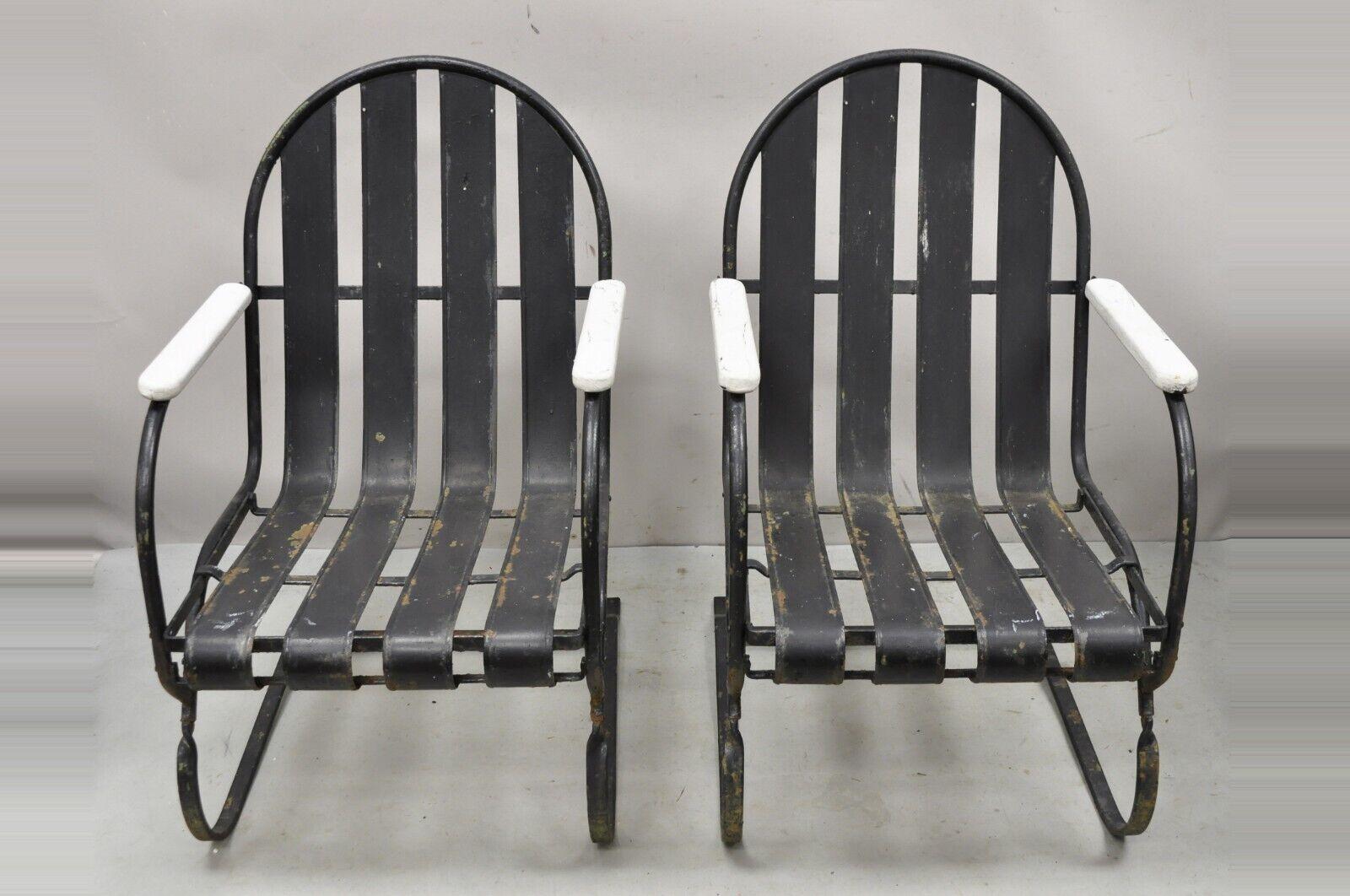 Pair Vintage Art Deco Black and White Steel Metal Slat Patio Bouncer chairs. Item features white painted wooden armrests, black painted metal bouncer frames, very nice vintage pair, great style and form. Circa Early to Mid 20th Century.