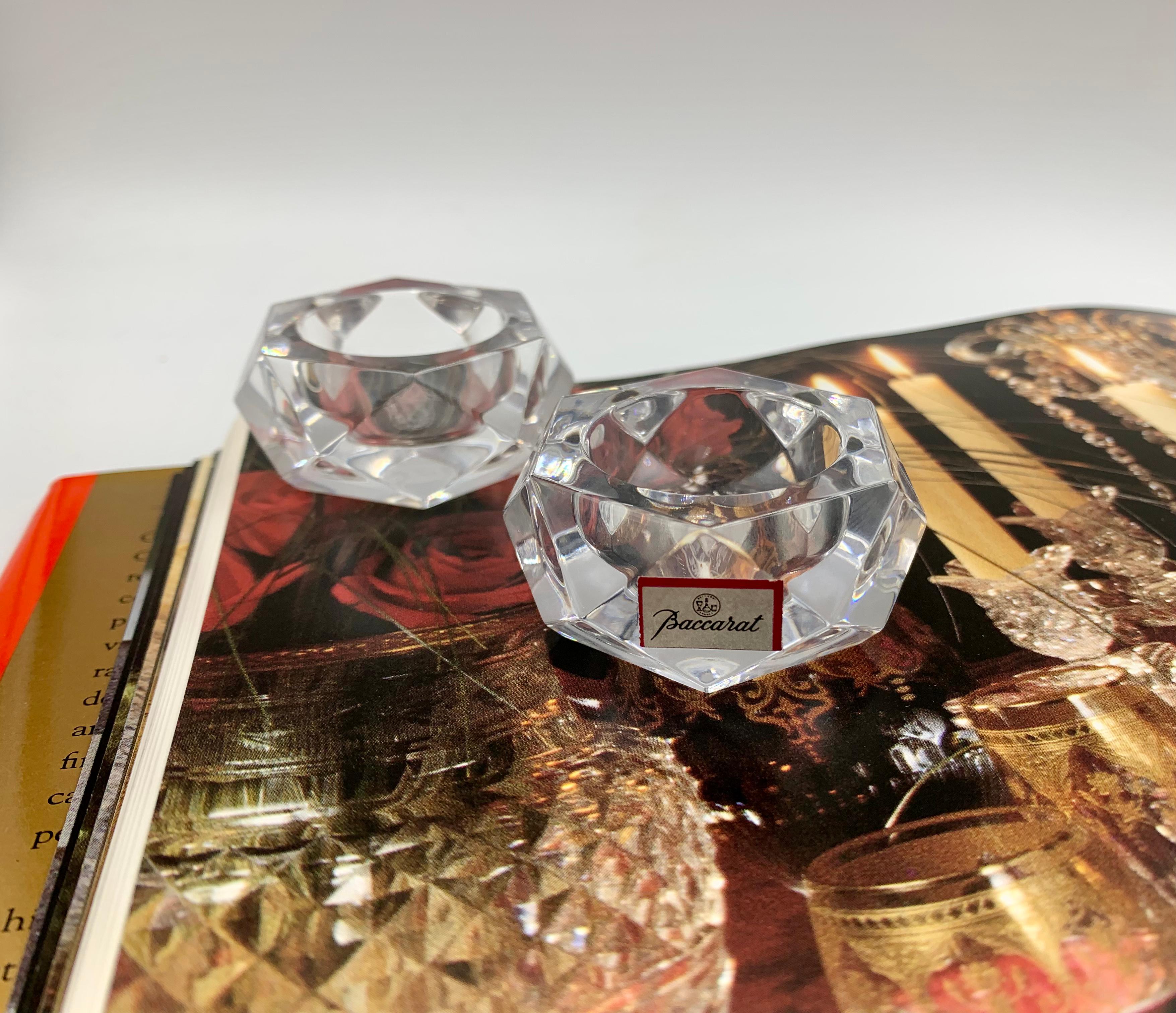 Fine pair of Baccarat crystal salt cellars in excellent condition with original label present. The sides are facet cut in rhombus and triangular shapes, the top with a circular space for the salt. Signed on the bases.
Wonderful housewarming or