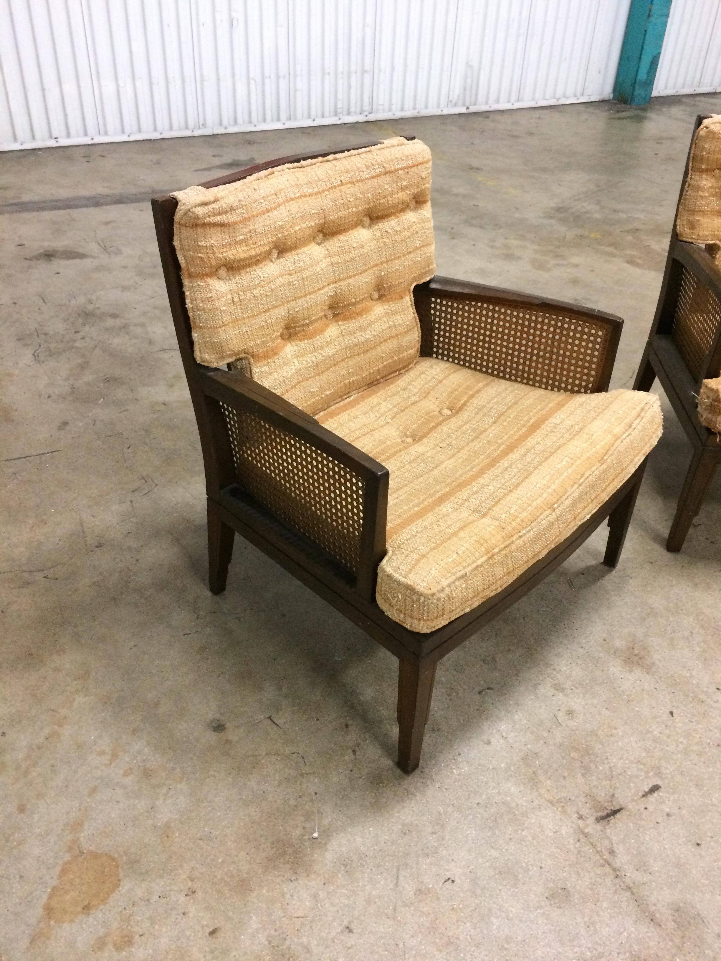 Great pair of number 6603 Baker furniture club of lounge chairs. Caning and wood are both in very good condition. Cushions need to be completely redone. From the 1960s well made and structurally sound chairs.