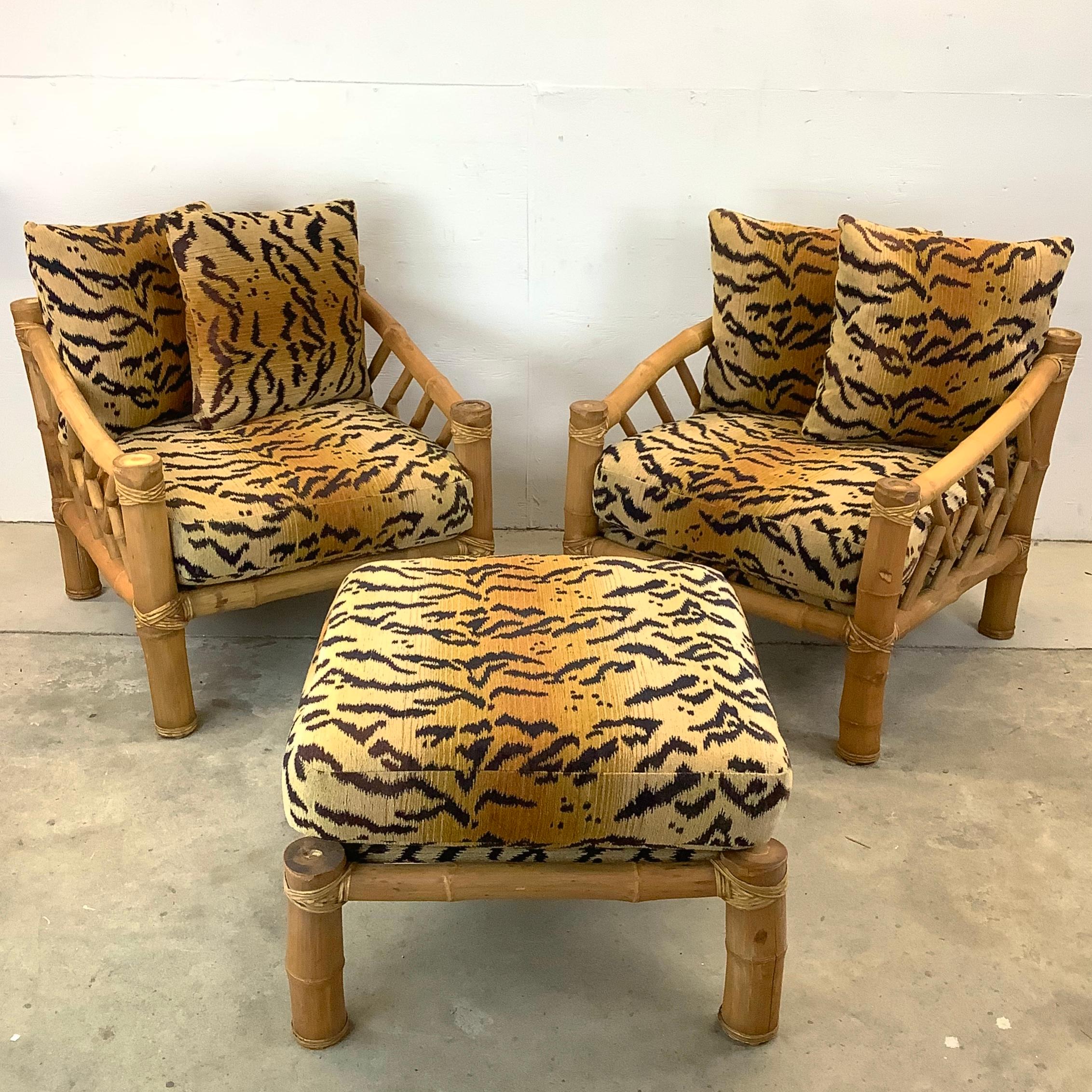 Step into the world of elegant sustainability with this pair of vintage bamboo lounge chairs and their companion ottoman, all adorned with an exuberant tiger-striped upholstery that adds volumes of boho charm to any setting. This set is a haven for