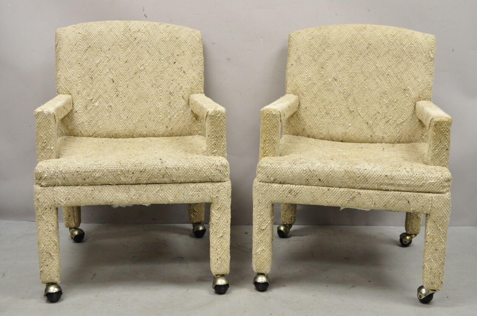 Pair Vintage Bassett Furniture fully upholstered parson style club lounge chairs. Item features rolling casters, fully upholstered beige nubby wool fabric, original label, very nice vintage pair, clean modernist lines. Circa late 20th century.