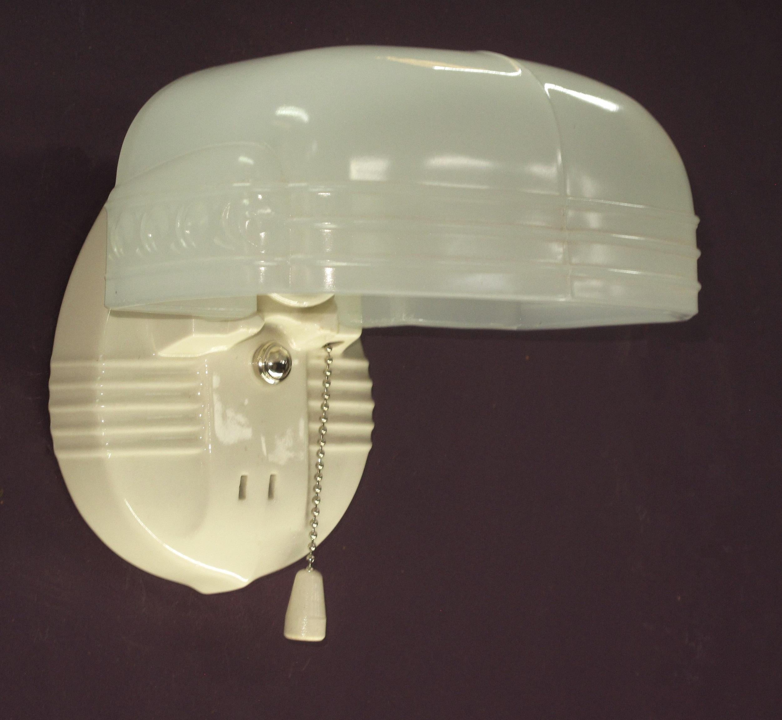 Priced for the pair, Single at $425
White porcelain sconce back with camphor glass colored shade. Both porcelain back and shade in excellent condition with no noticeable chips and no cracks.  Single bulb.
Pull switch disassembled, cleaned and