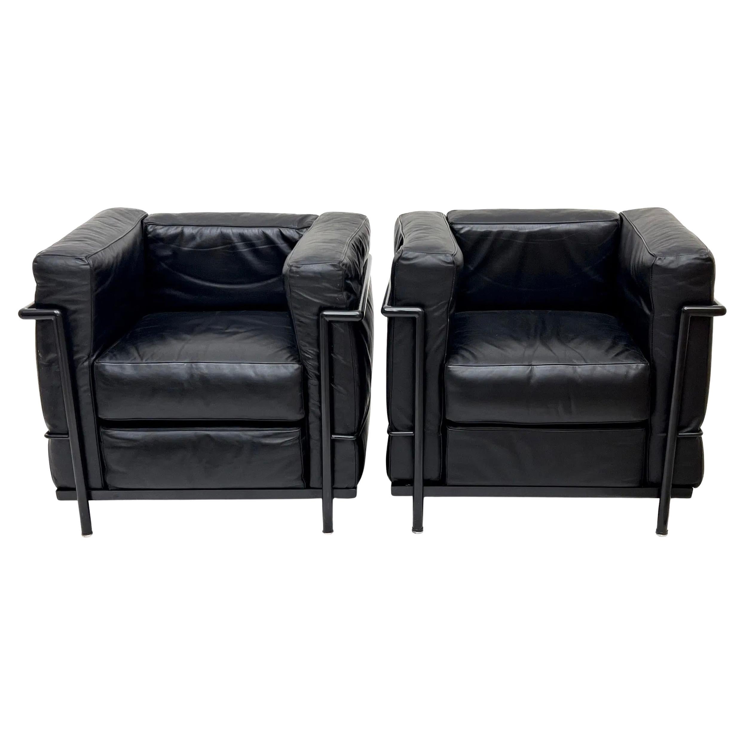 Pair Vintage Black leather Black frame lounge chairs style of Le Corbusier LC2