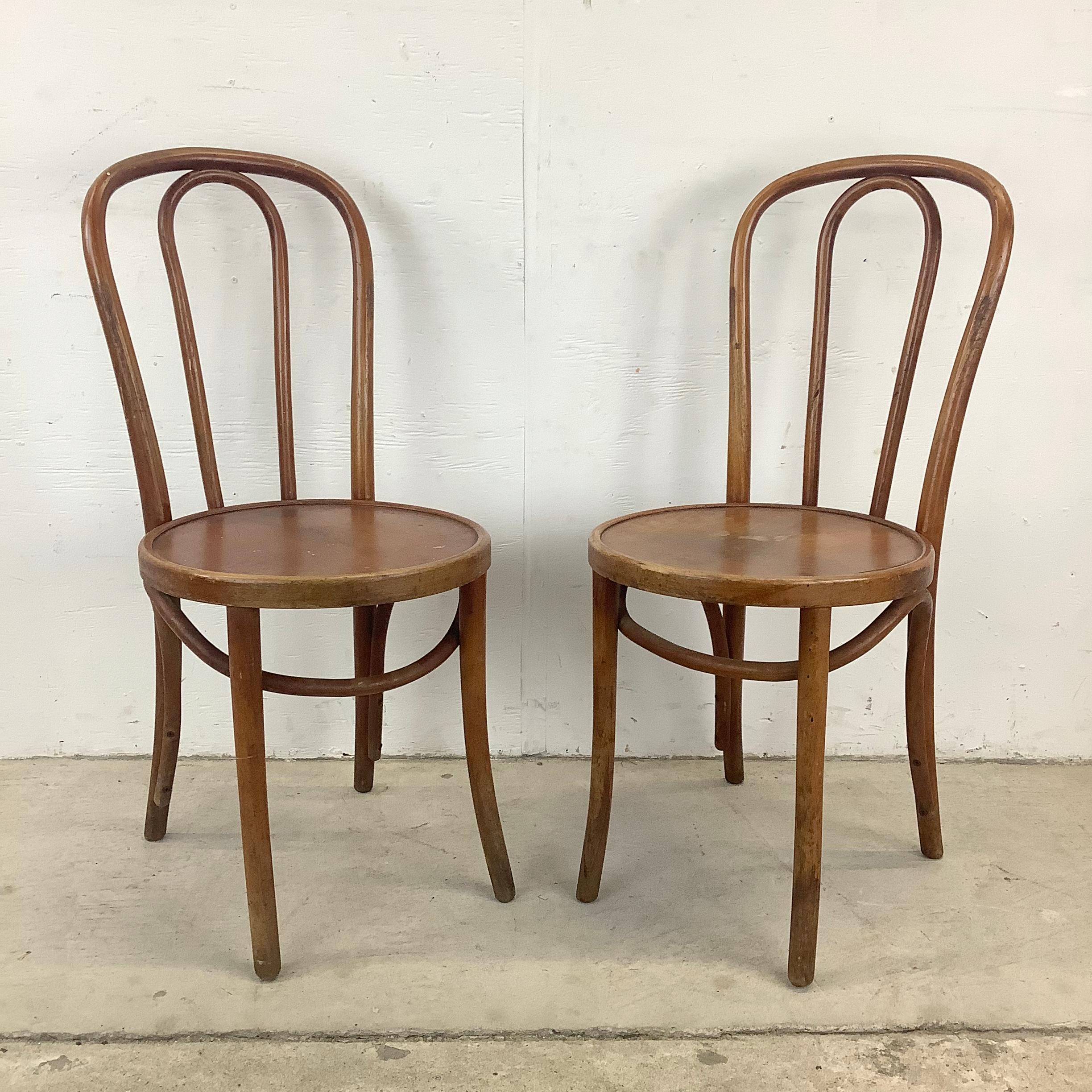 Step into the charm of yesteryear with this vintage pair of Bentwood Thonet Cafe Chairs, a delightful blend of classic design and enduring appeal. Crafted with bentwood seatbacks that boast the iconic Thonet style, these chairs exude timeless
