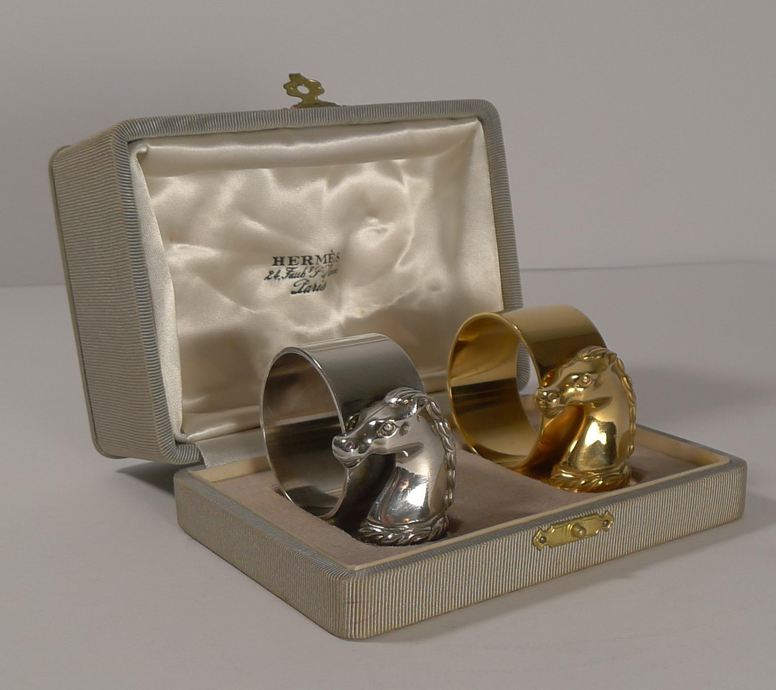 A rare pair of vintage Hermes napkin rings from the TÊTE TORSADE line with horse's heads in their original presentation case.

Naturally top quality produced by the French silversmith, Ravinet d’Enfert, this was the silversmith used by Hermes for