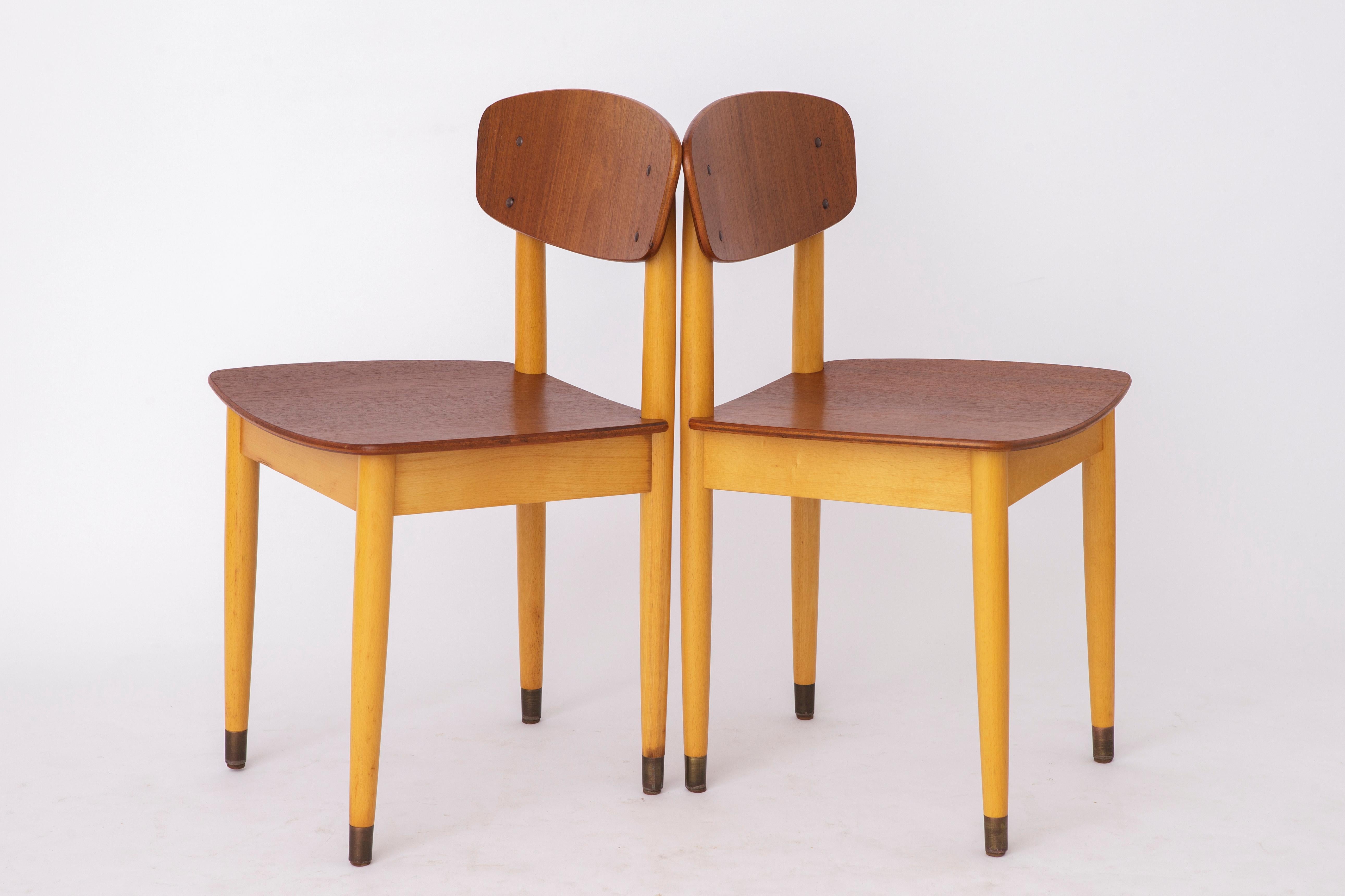 Pair mid century vintage chairs. Unknown manufacturer. 
Origin: most likely Germany or Netherlands. 
Displayed price is for a pair. Totally up to 4 chairs available. 

Stable wood frames. No wobbling corner joints. 
Seat and back part are made of