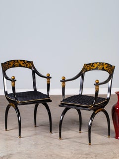 Pair of Vintage French Empire Chapuis Ebonized Gilt Chairs, circa 1950