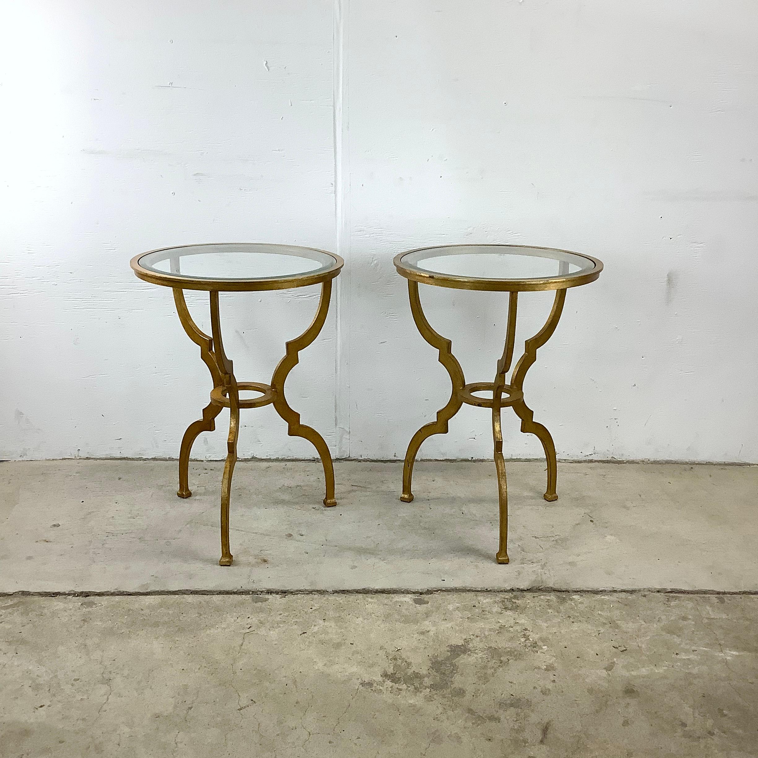 Step back in time with these vintage gilt side tables, a pair that exudes the elegance and charm of a bygone era. Each table stands on sculpted gilt legs, their curves and contours reminiscent of classic European design, bringing an air of
