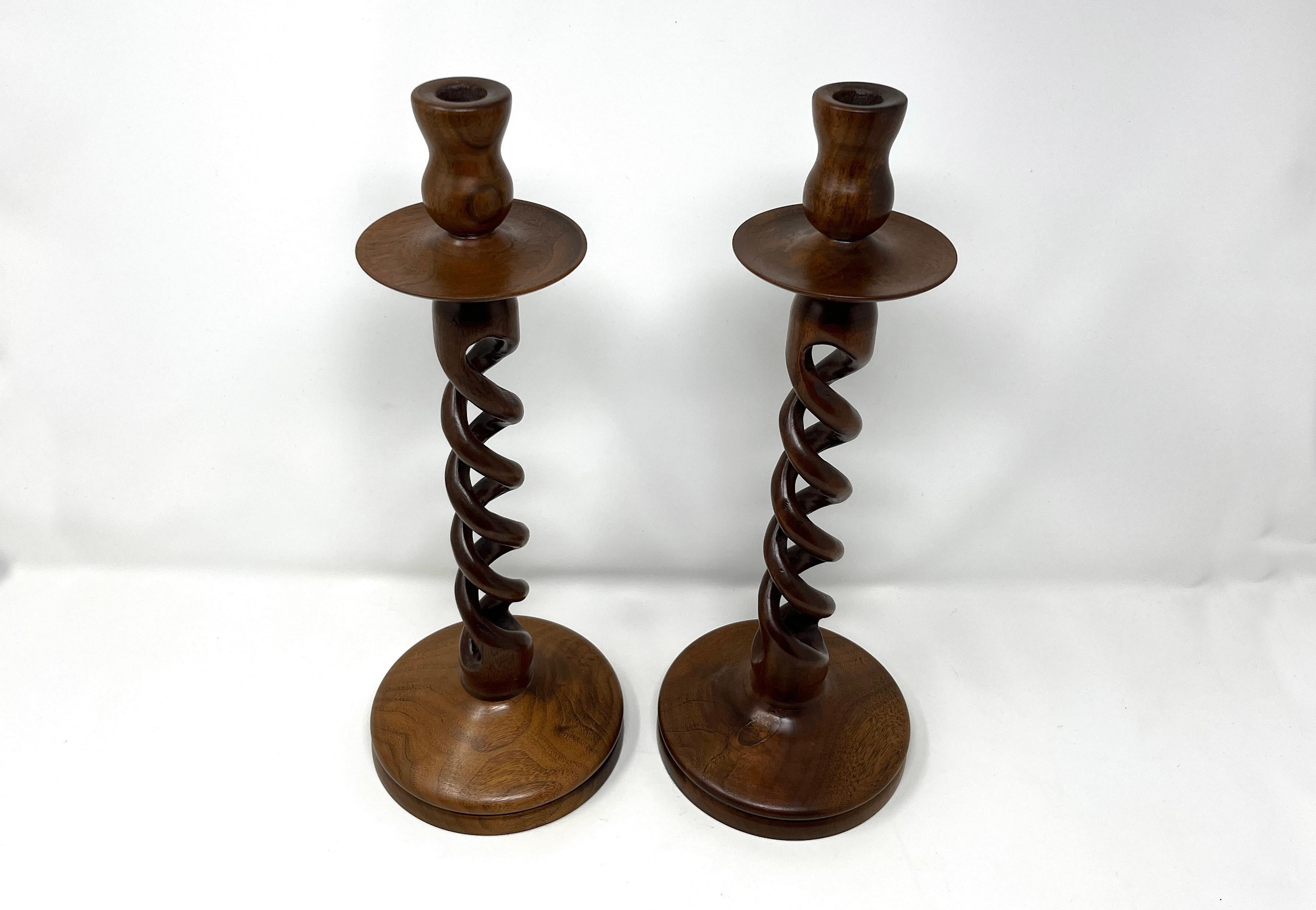 Hand carved solid wood candlesticks in the classic English barley twist or open twist style. The center open twist section is carved from a single piece of wood. Exact age and maker unknown.

Excellent vintage condition. Appear to be unused.

They