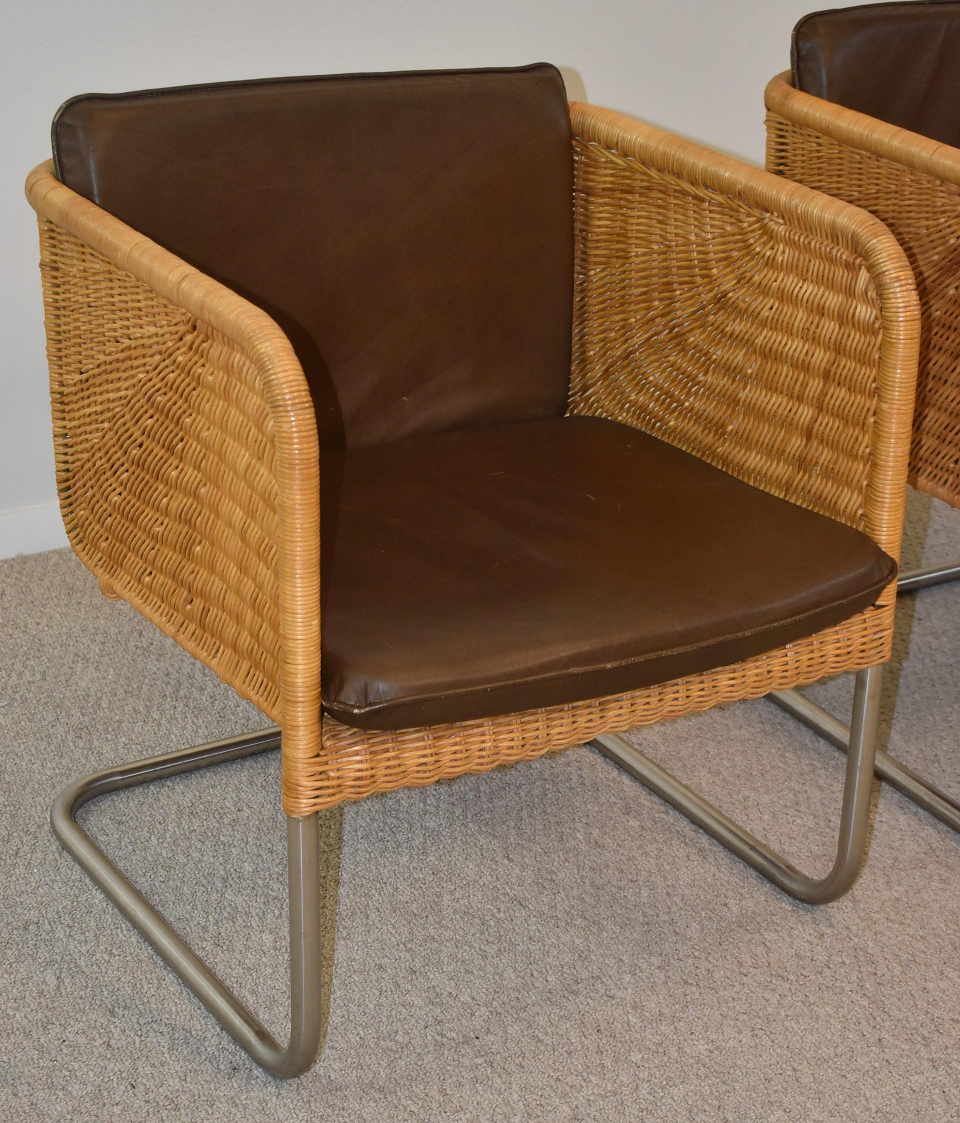 Vintage pair Harvey Probber wicker, tubular chrome and leather side chairs D43 Model. Removable brown leather cushions, and chrome is in fantastic condition unpitted, untarnished. Cantilever design. These chairs are in excellent. Measures: 24