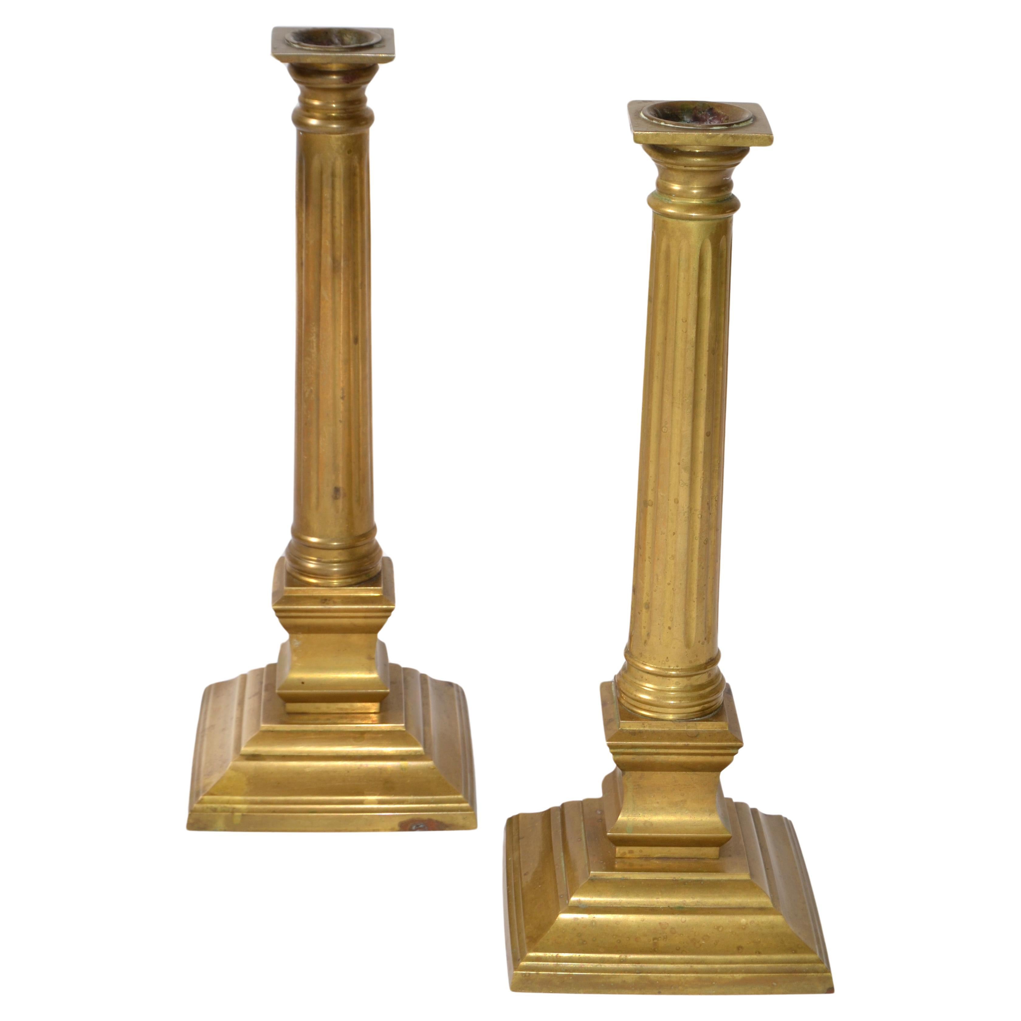 A stunning pair of vintage Hollywood Regency Brass Column candlesticks. Handmade and Hand designed by the iconic Maitland Smith, Hong Kong and tagged on the bottom. 
Great for Your Fireplace Mantel, Dresser or Console Table.