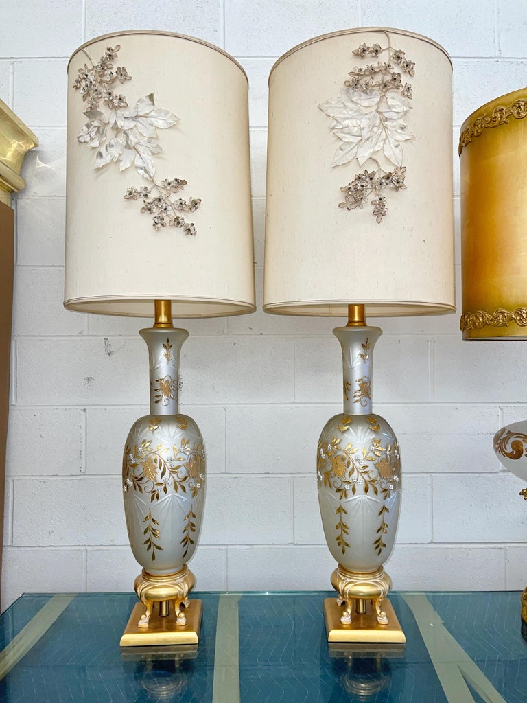 Pair of outrageously over the top (bordering on kitsch) monumental table lamps created in the early 1960's in the style of Carl Falkenstein, Marbro and Rembrandt lighting.
The ultimate in mid-century Hollywood Regency including original drum shades