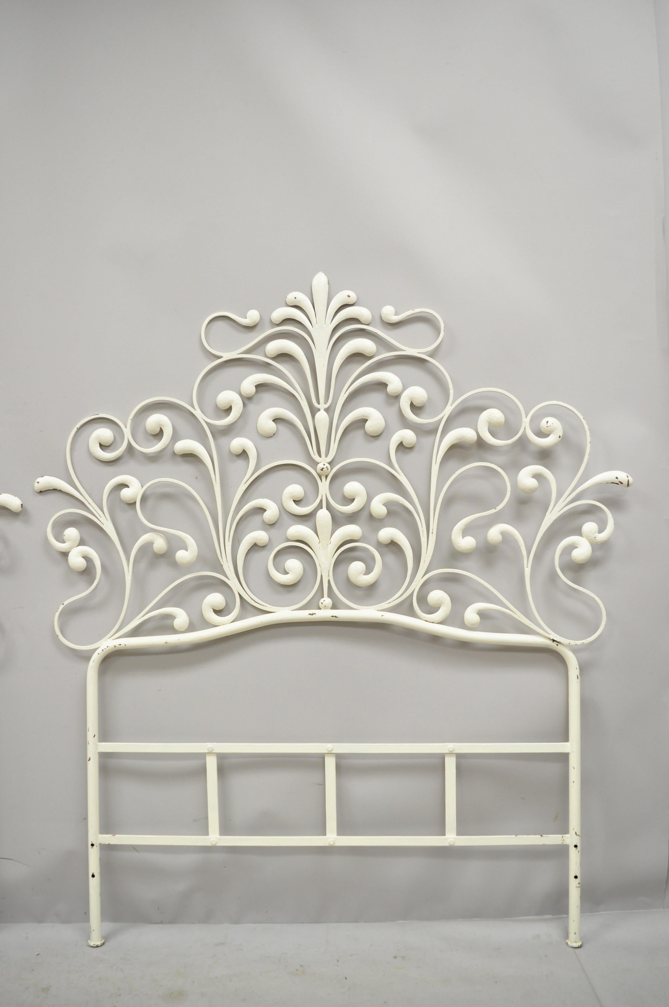 Pair of vintage Italian Rococo Hollywood Regency ornate iron twin single bed headboards. Item features ornate wrought iron frames, very nice vintage item, great style and form circa mid to late 20th century. Measurements: 53
