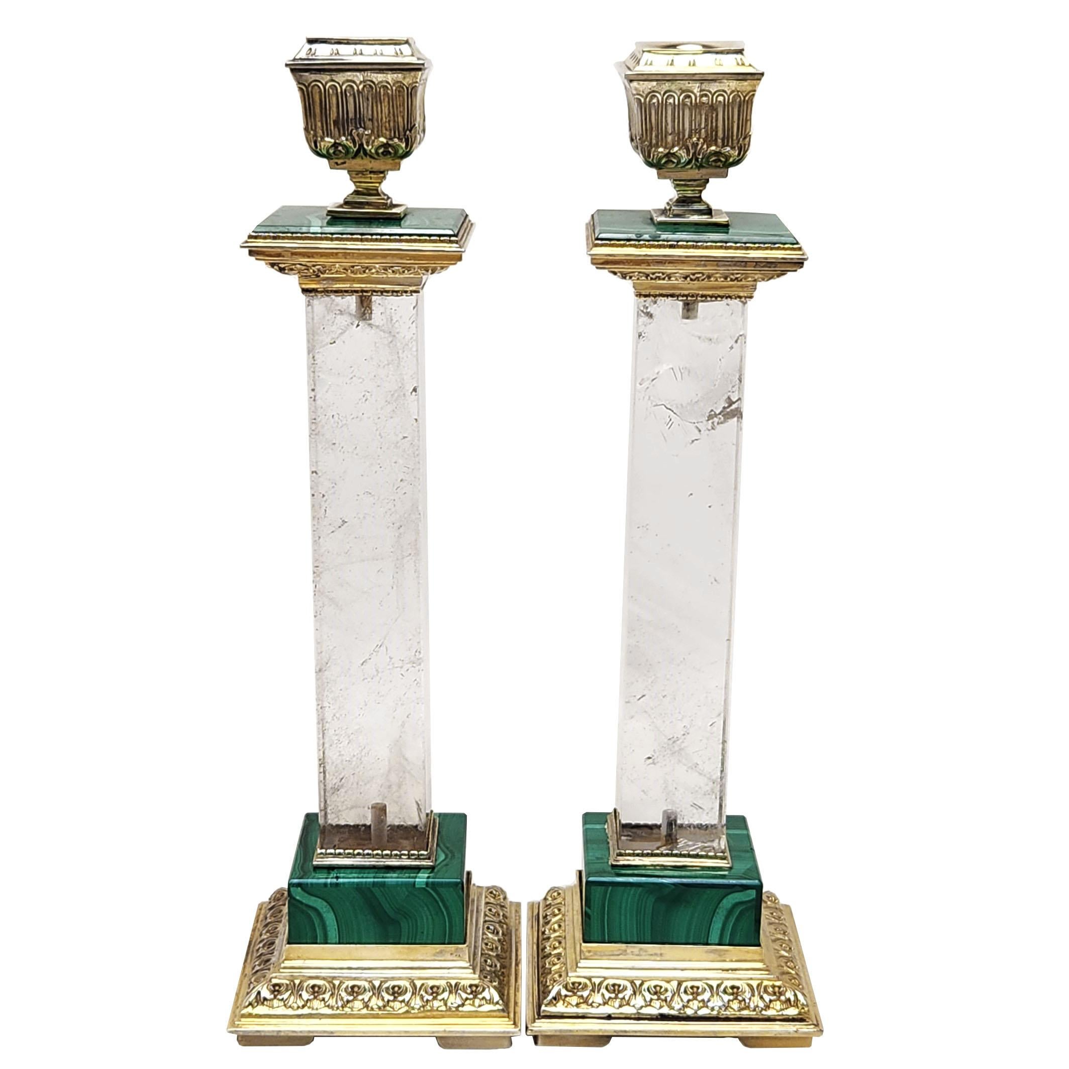 A magnificent pair of rare Italian Silver Gilt mounted Candlesticks with polished rock crystal columns and malachite details on the base and the top of each Candlestick. Each Rock Crystal Column has beautiful natural inclusions contained in the