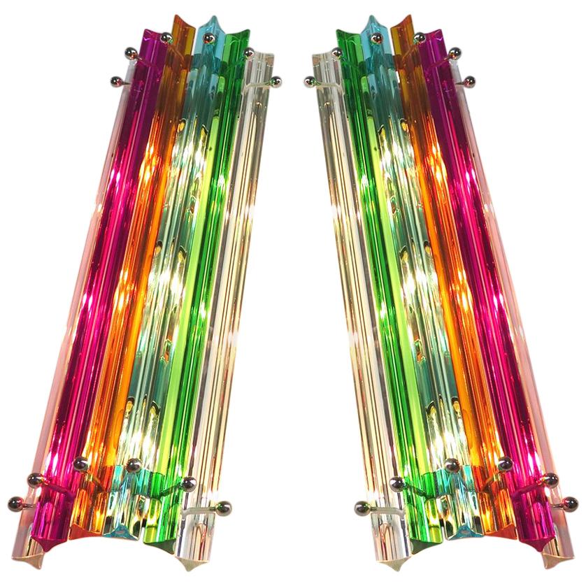 Pair of vintage Murano wall sconces, multi-color triedri, Column Mariangela model
Fantastic pair of vintage Murano wall sconce made by 6 Murano crystal prism (triedri) for each applique in a chrome metal frame. The shape of this sconce is column.