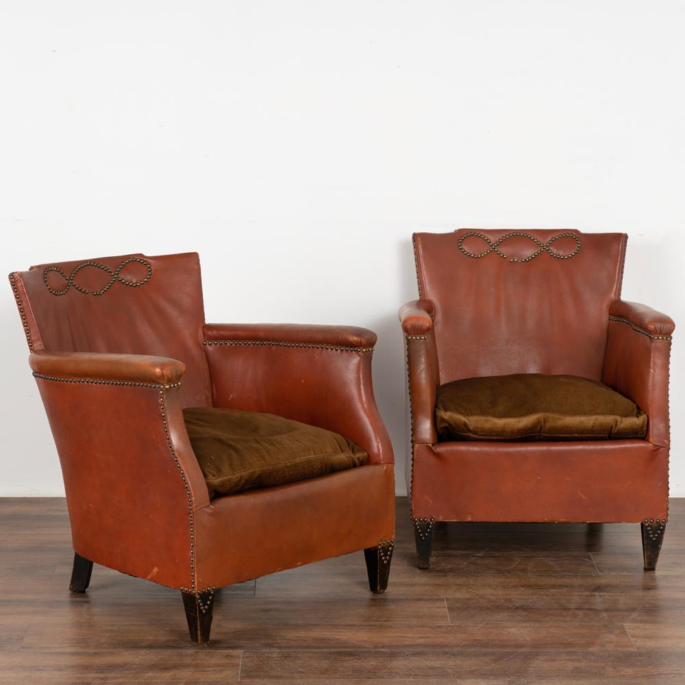 Vintage pair of club or lounge chairs designed by Otto Schultz and produced by Boet of Goteburg, Sweden.
The notable use of nail heads as decoration were one of Schultz's style statements.
Seats are a vintage crushed velvet; missing a few nail