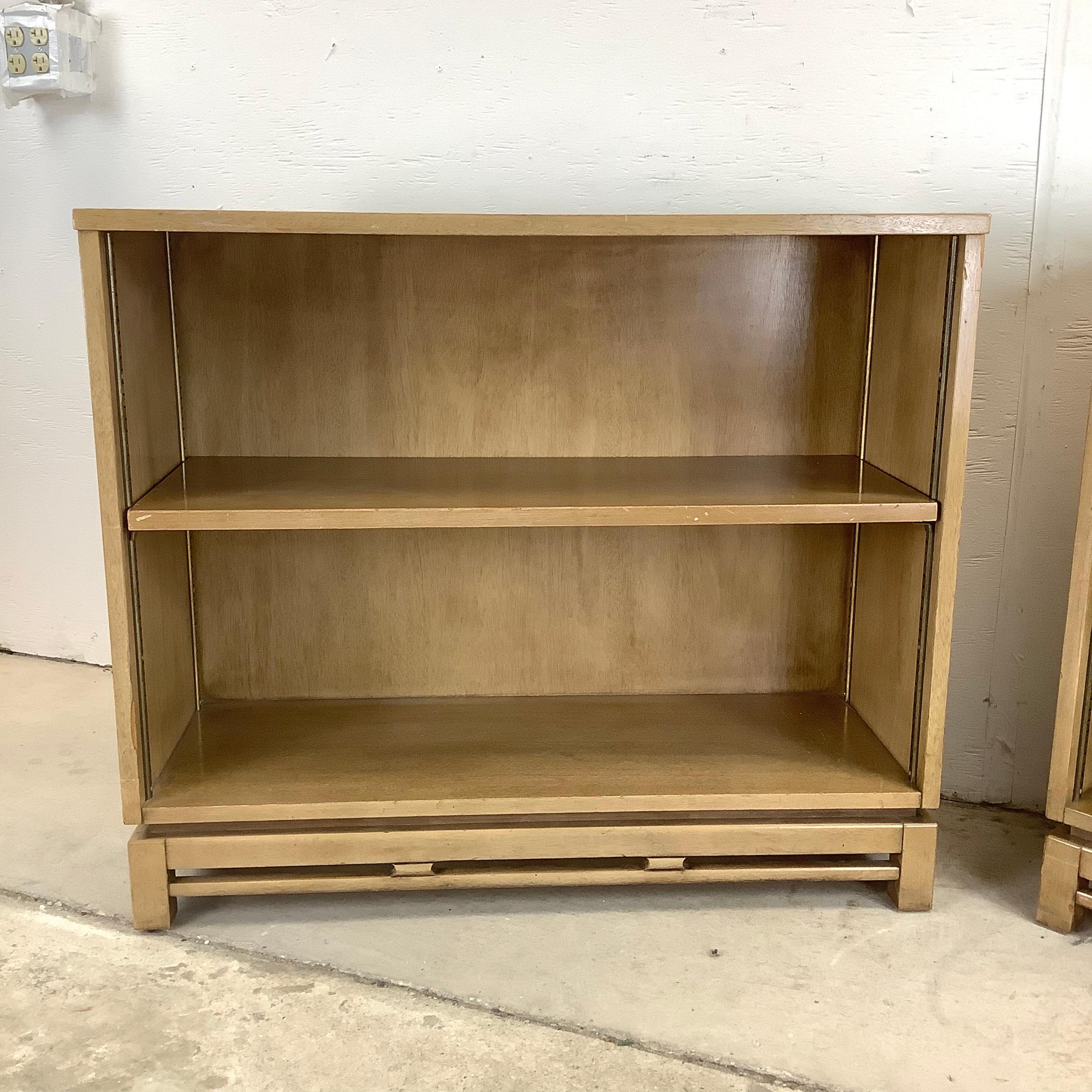 Bring timeless mid-century modern charm to your space with this matching Pair of Low Bookcases from the Kent Coffey Simplex Line. Known for their sleek design and exceptional craftsmanship, these vintage bookcases exemplify the understated elegance