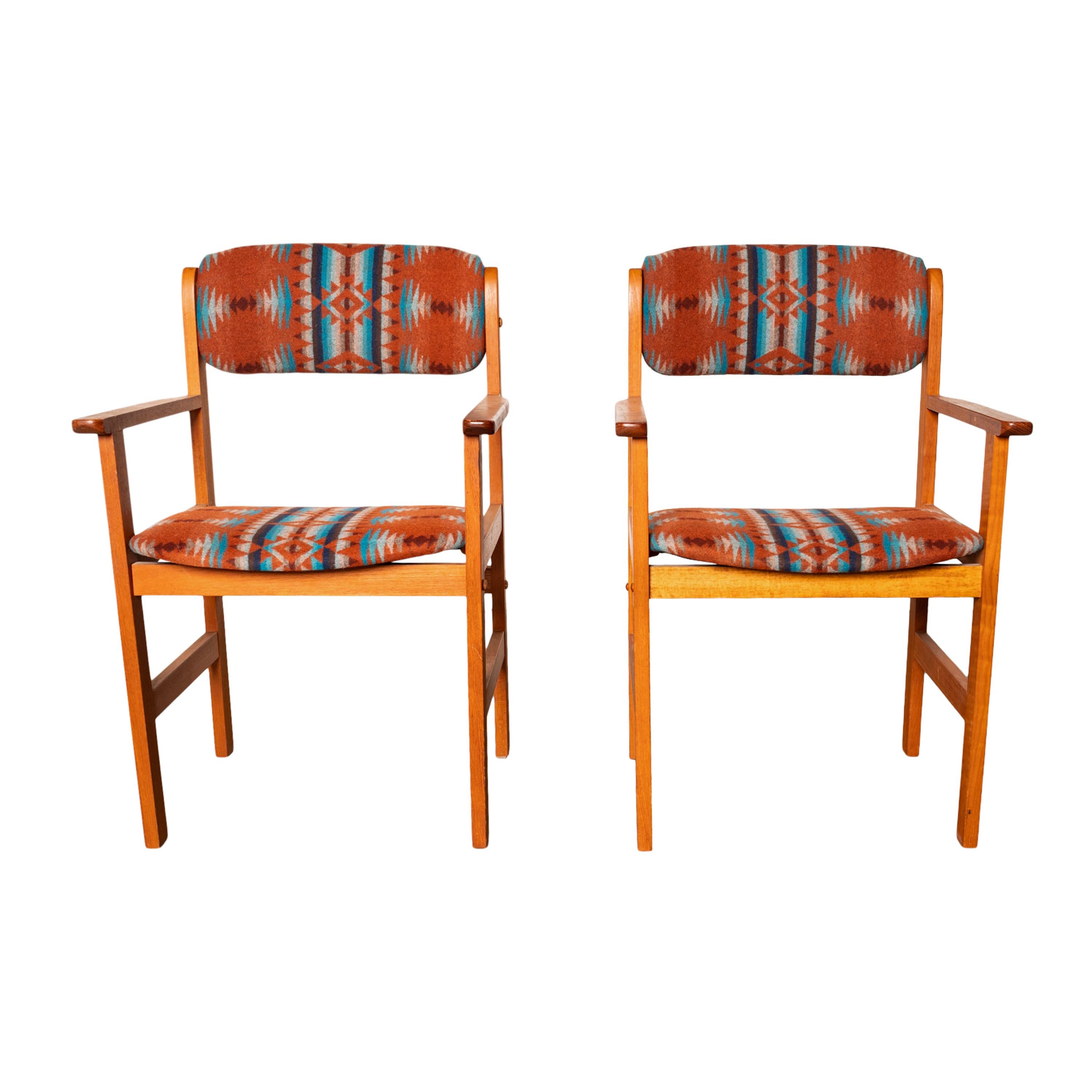 A good pair of Danish Mid Century Modern teak Captain's armchairs by 