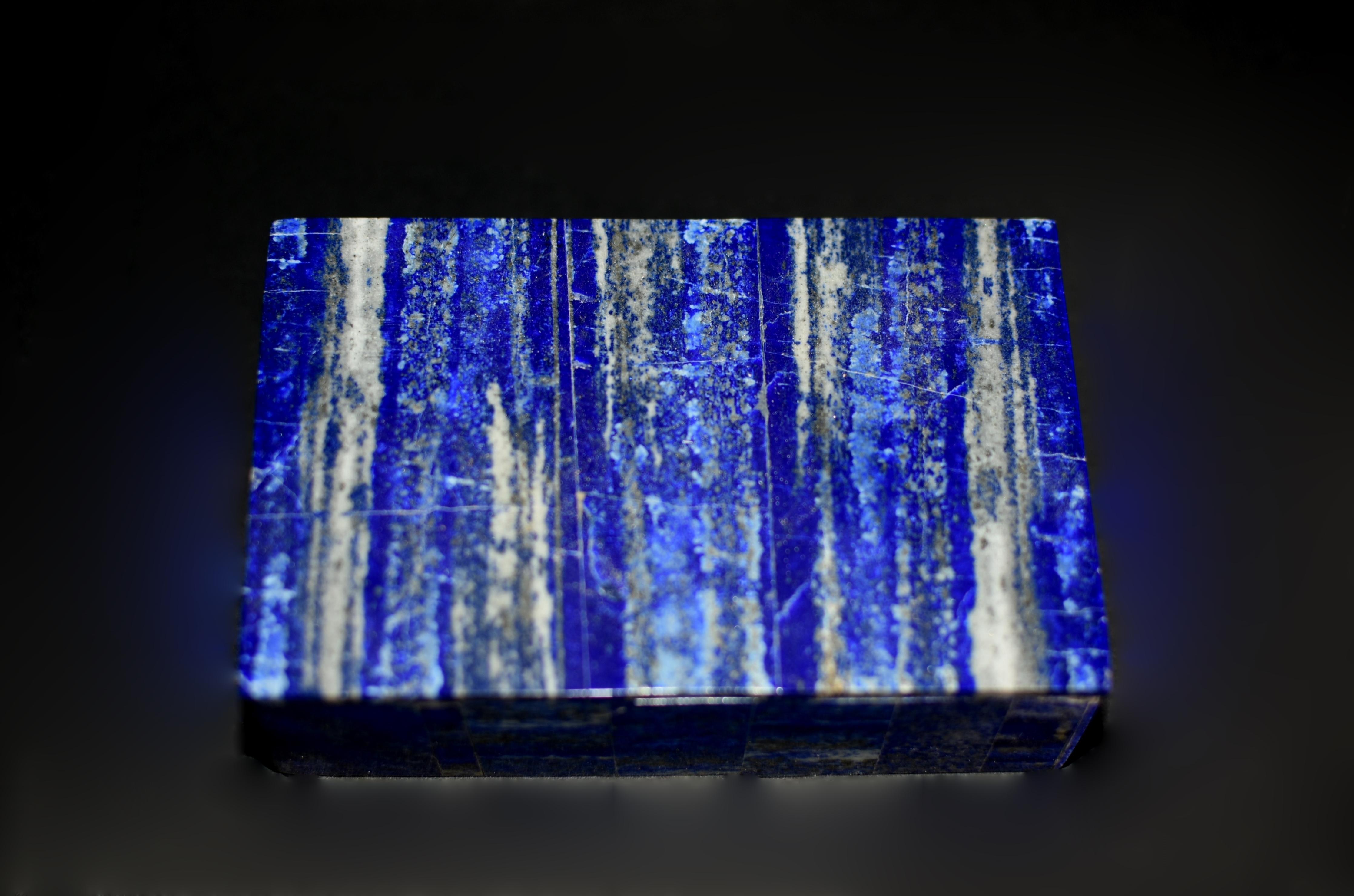 A pair of beautiful vintage natural lapis boxes. Crafted from the finest grade AAA natural lapis lazuli, these boxes use carefully selected pieces with matching stone patterns resembling a forest of beech trees against blue skies. Saturated cobalt
