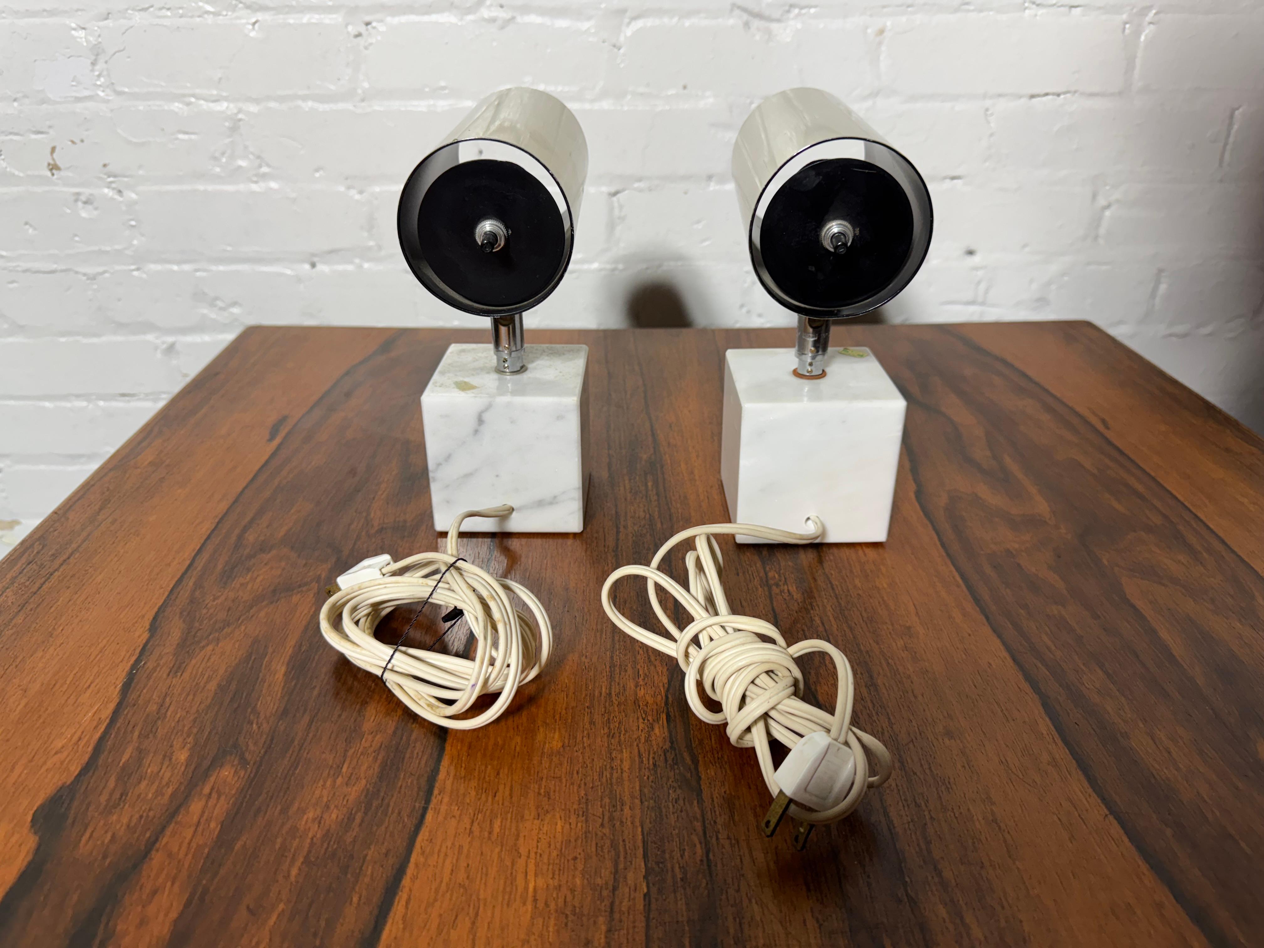 Stunning pair  1970's Carrara marble and chrome table lamp by Neal Small for Koch & Lowy. These Mid-Century Modern lamps pairs well with all styles and is in good original condition.

The overall dimensions are 8
