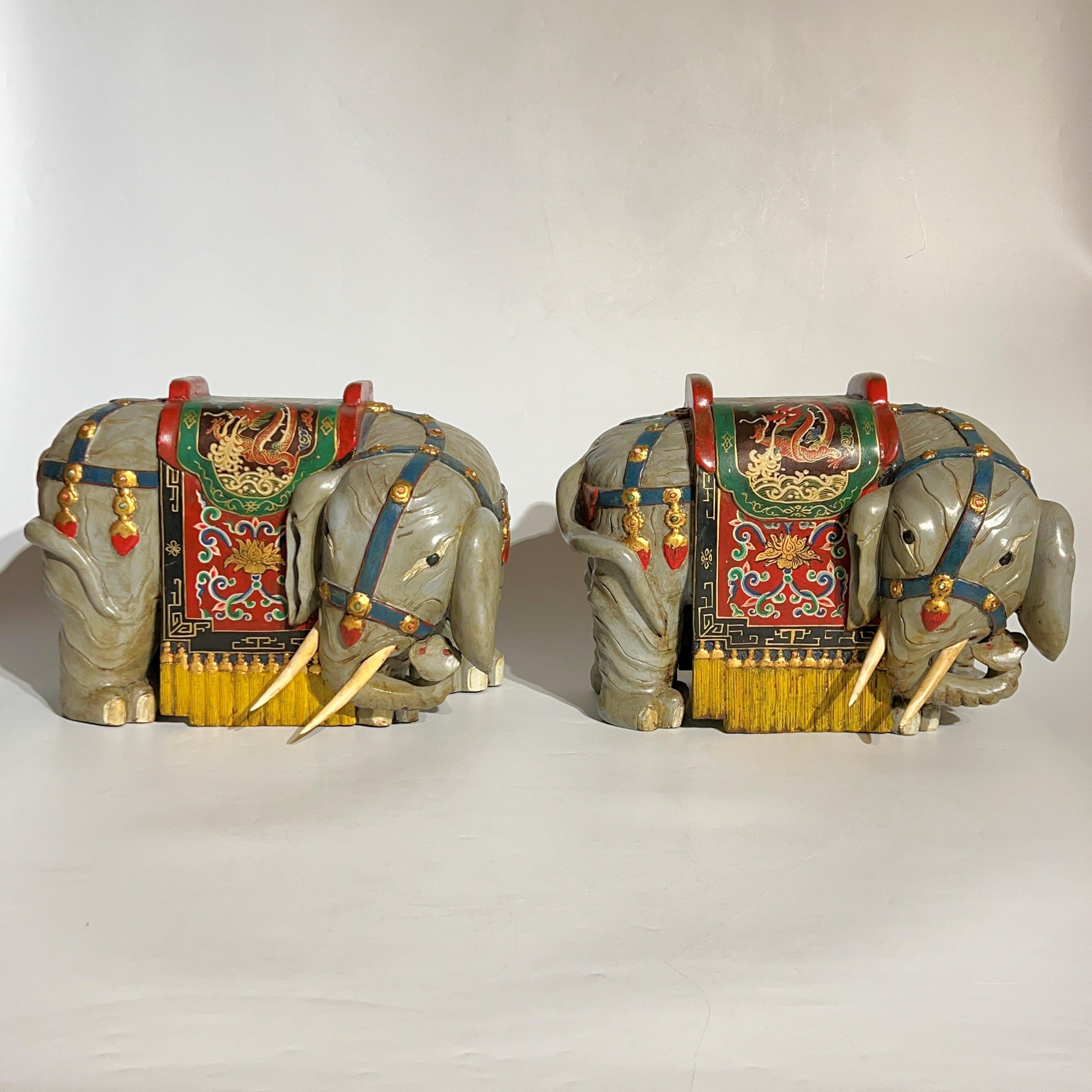 Pair of whimsical vintage wooden Chinese  ceremonial processional elephants with hand-painted Chinese designs.