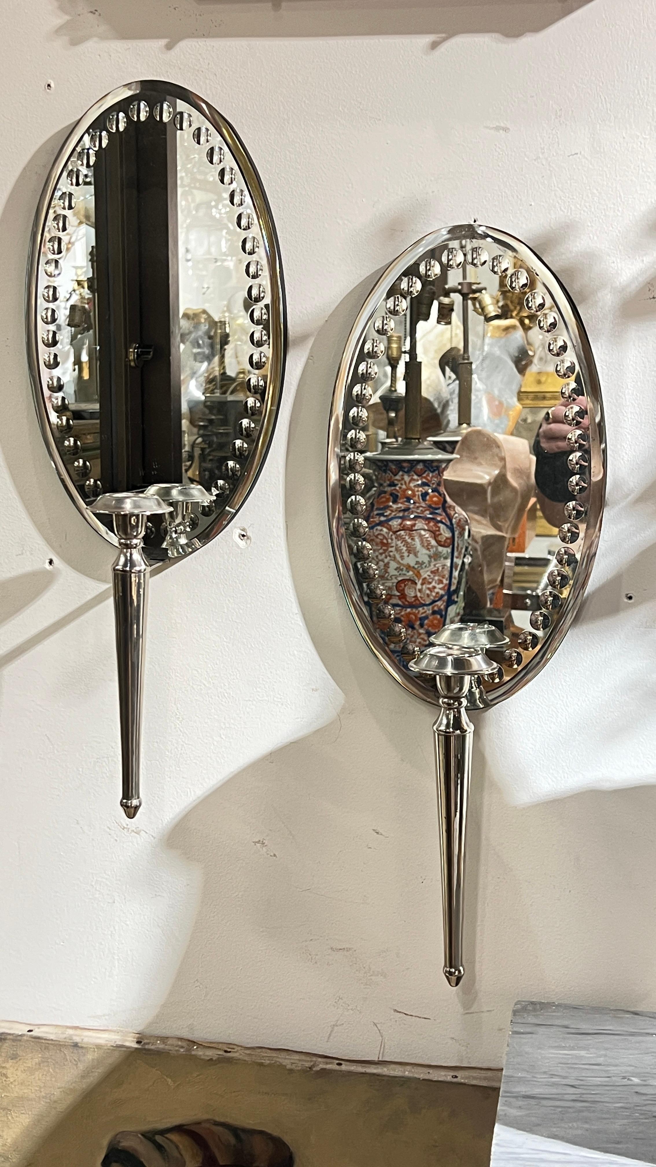 Mid-Century Modern Pair Vintage Oval Mirror Back and Silverplate Sconces For Sale