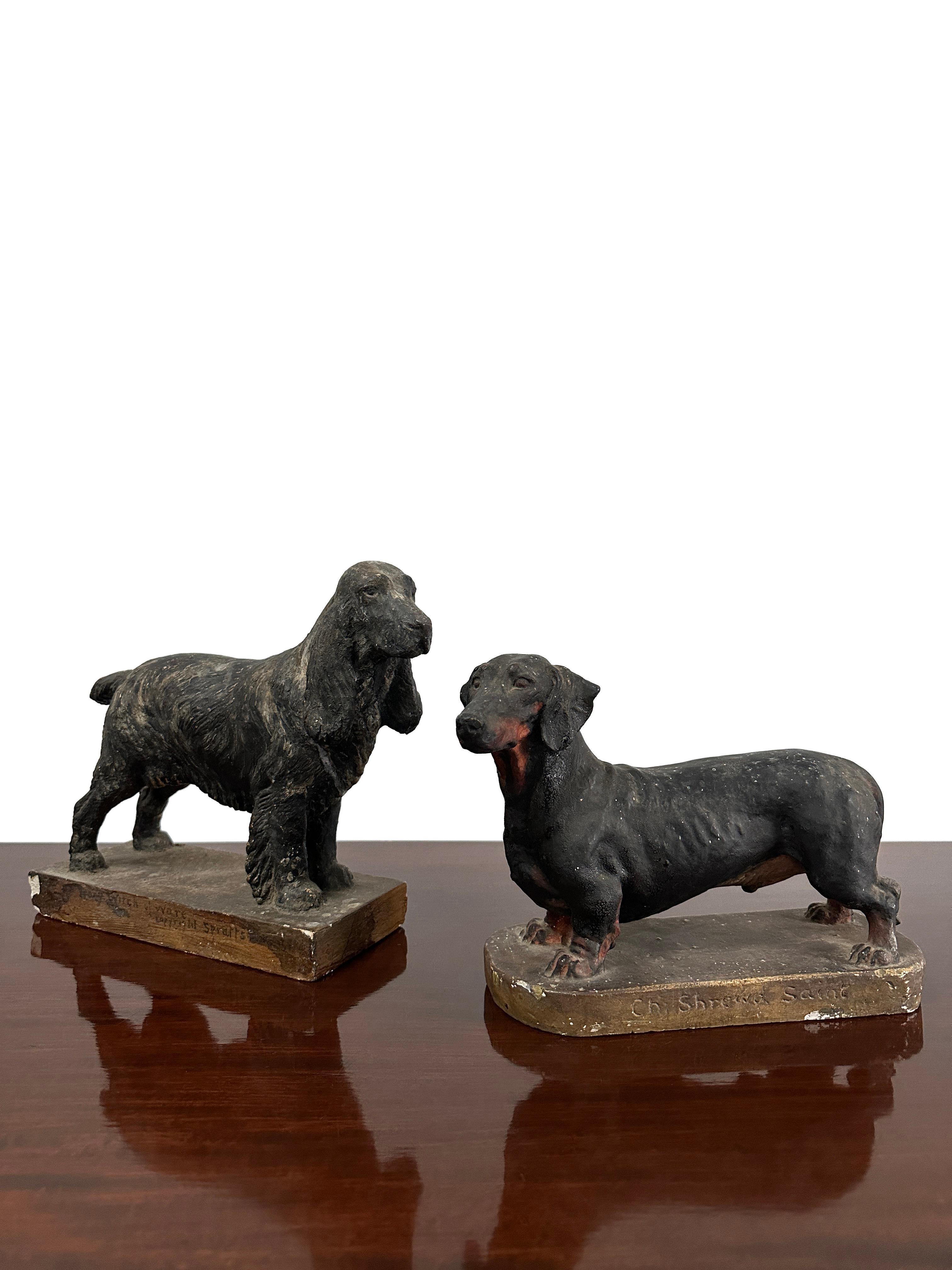 - An incredible pair of painted plaster model dogs by Frederick Thomas Daws (1878-1956), England, Mid-Twentieth Century.
- The models have a wonderful lifelike quality in regards to their design and sculptural form, both are in beautifully worn