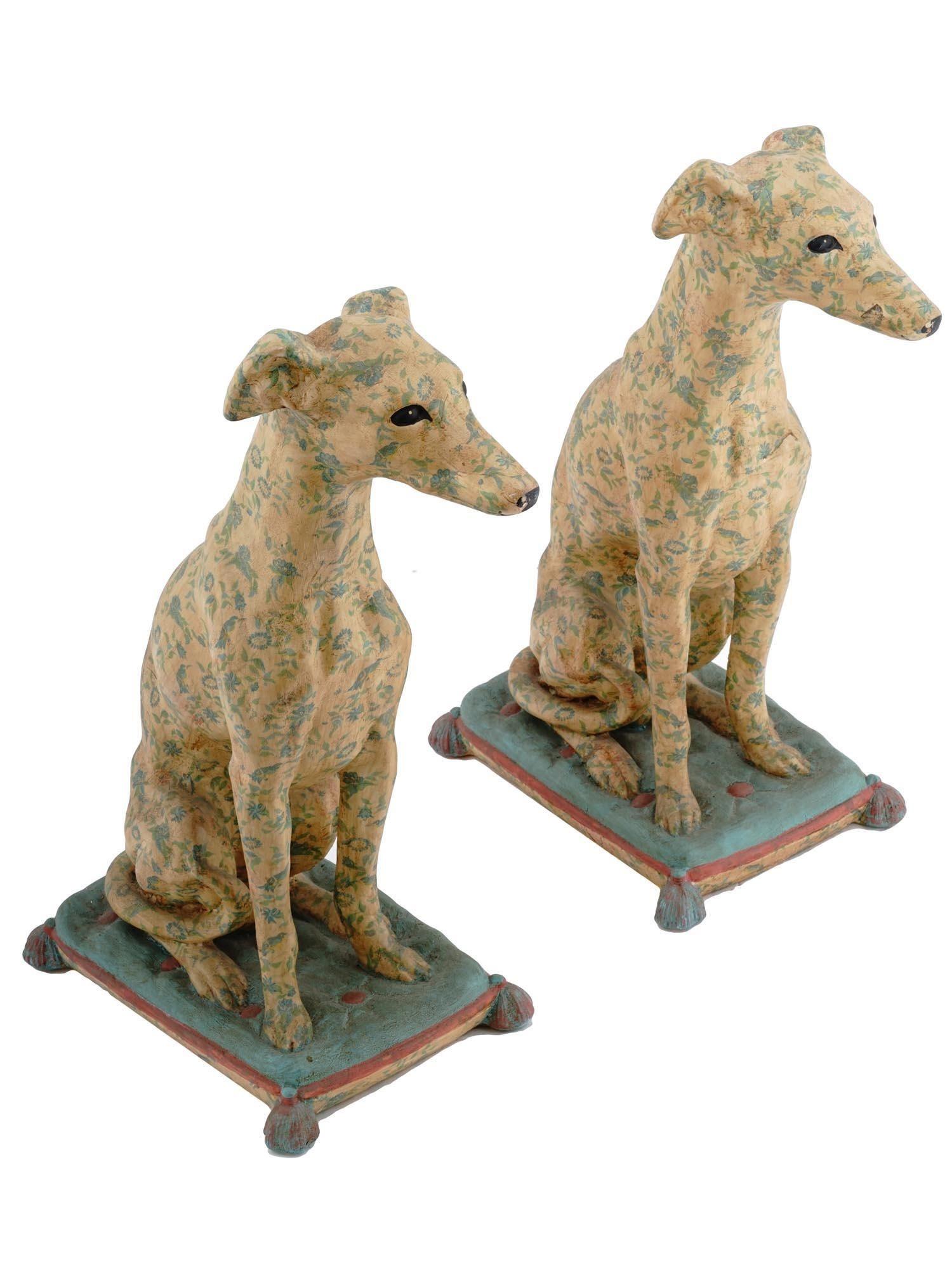 Pair of chic Italian glazed and hand-painted and stenciled whippets measuring 21 3/4 inches tall.  Each in good condition.