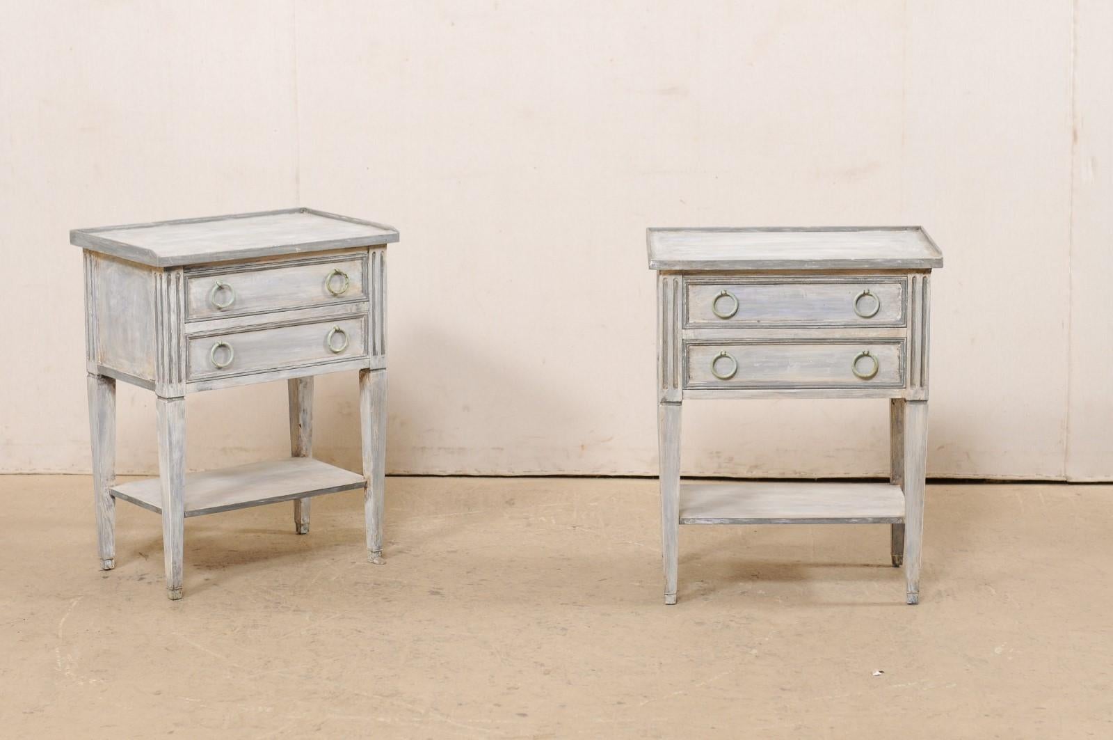 A vintage pair of painted wood side chests, with lower shelf, from American furniture maker 