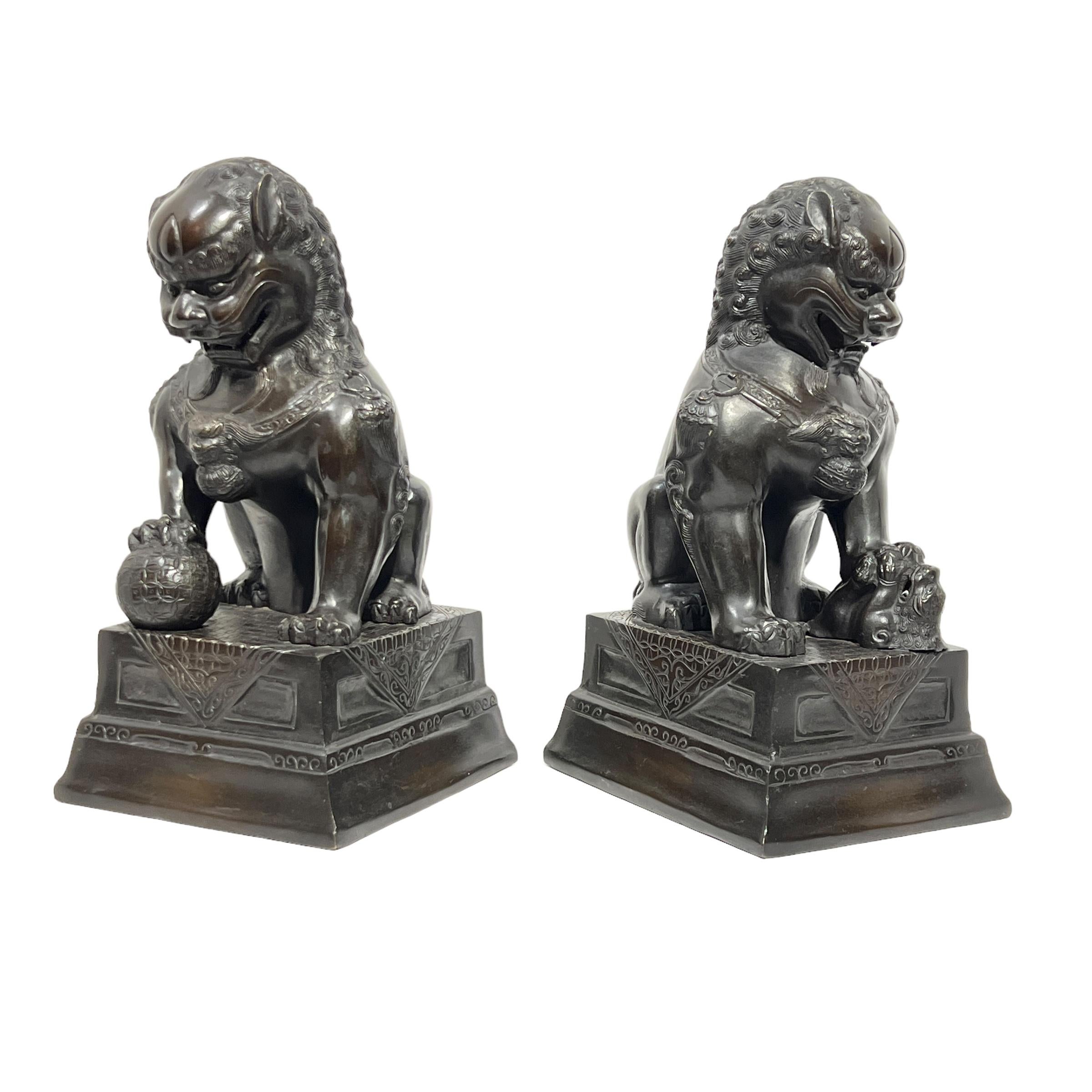 Pair Vintage Patinated Metal Foo Lion Sculptures In Good Condition For Sale In New York, NY