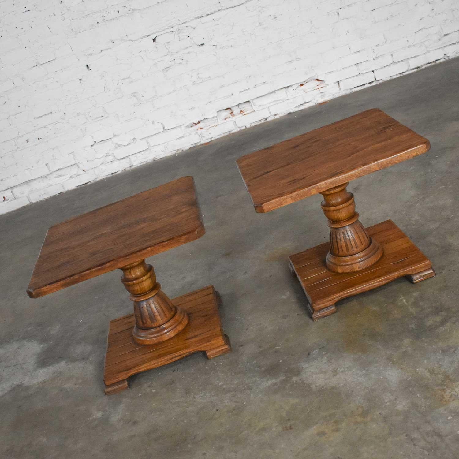 Great pair of vintage ranch oak pedestal side tables with acorn brown finish by A. Brandt. Beautiful vintage condition. The tops have been refinished, stained, and waxed. Totally different wood cuts show differently. Please see photos, Circa