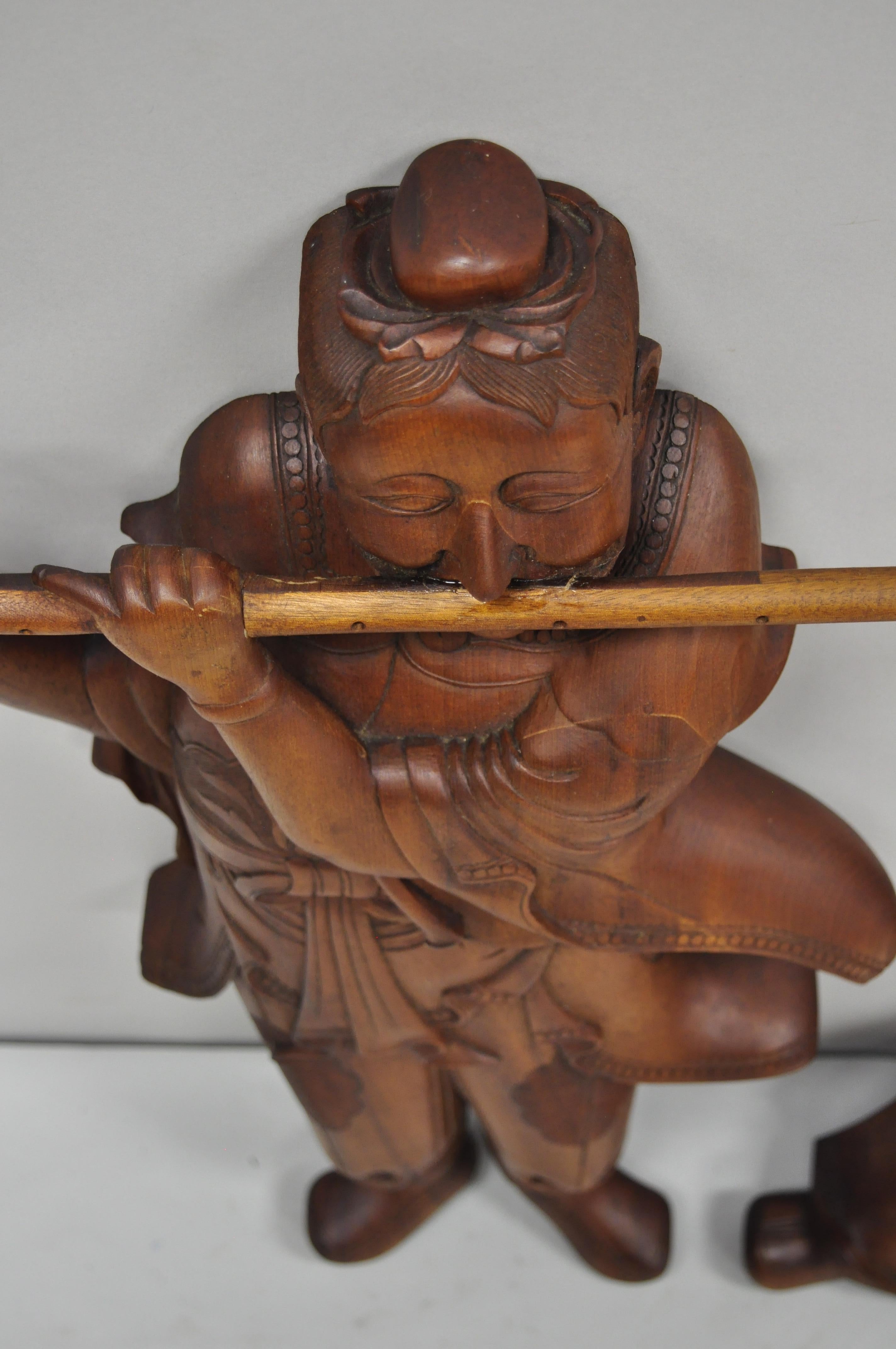 Chinese Chippendale Pair Vintage Ricardo Lynn Carved Teak Wood Oriental Figures Flute Player Wiseman For Sale