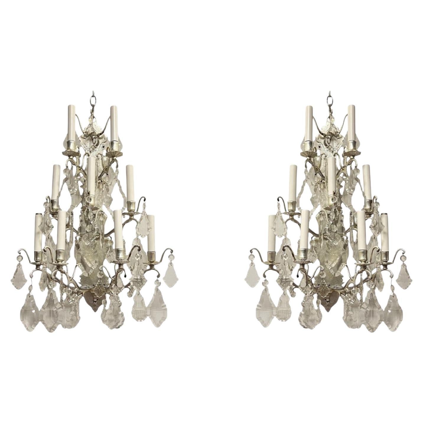 Paire d'appliques vintage à 9 lumières en bronze argenté et cristal