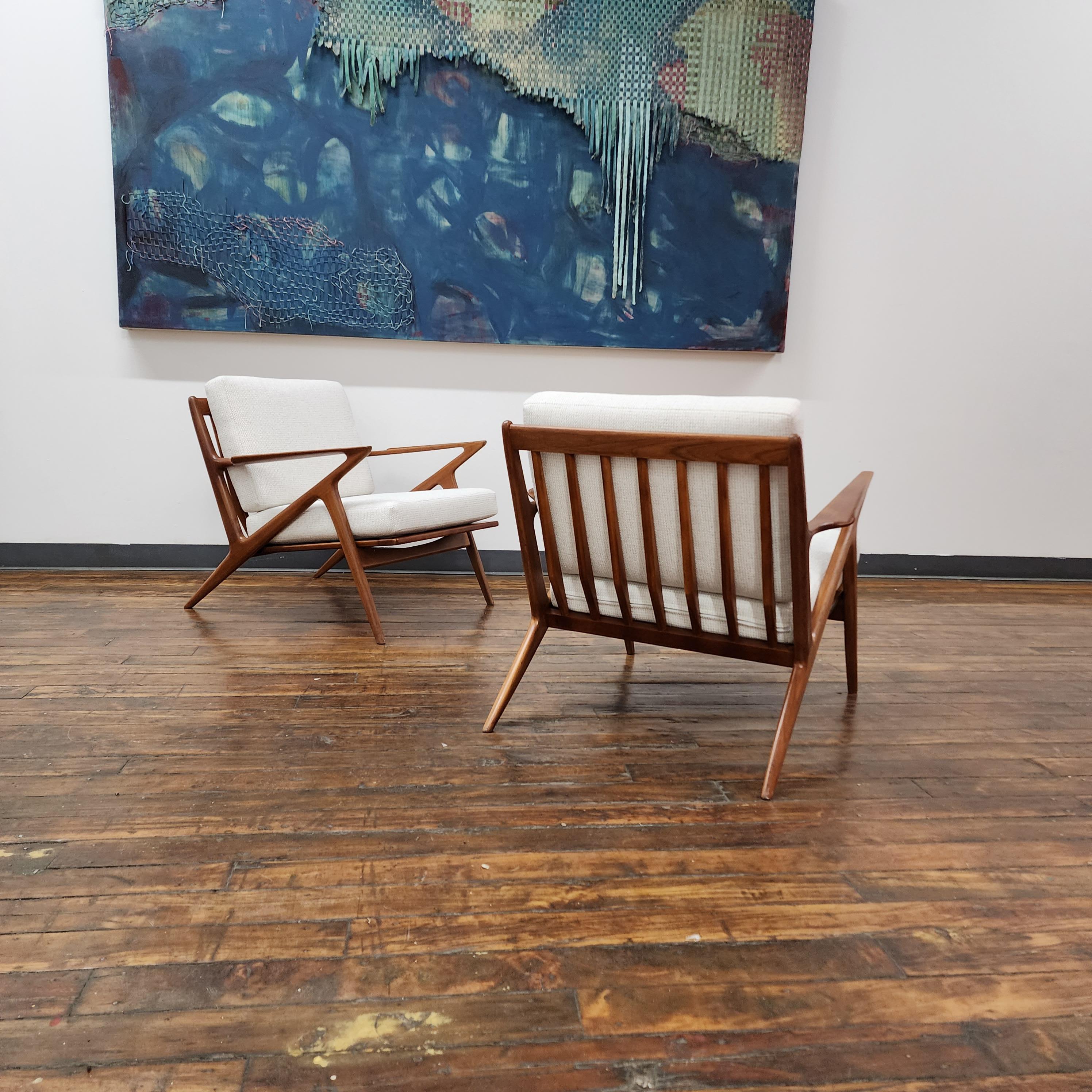 Beautiful pair of solid teak z chairs by poul Jensen for Selig. this iconic chair has been expertly refinished and has new foam and fabric Upholstery. The fabric is Bernhardt Interiors landscape: Winter. 

28in H x 28in W x 32in D
Seat Height