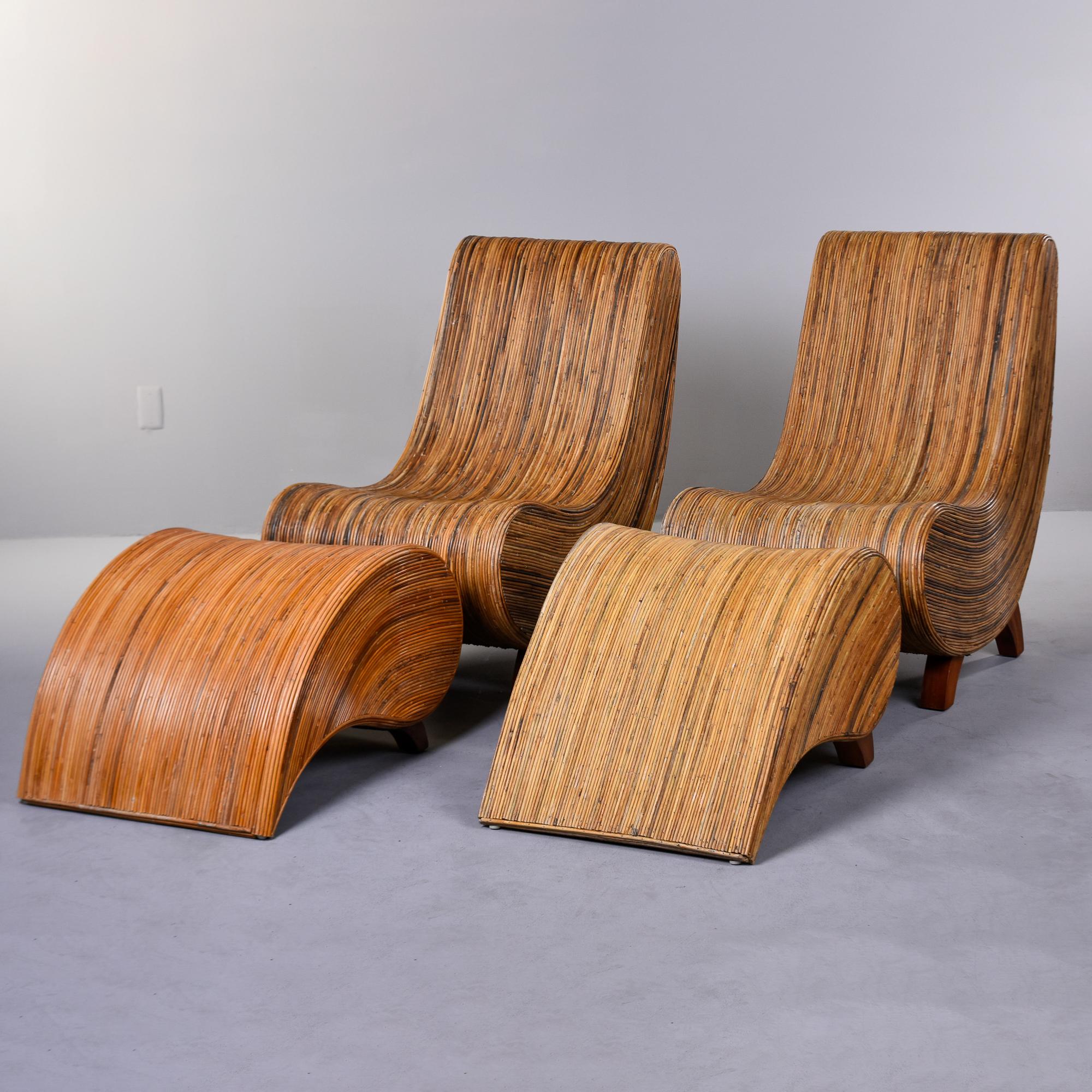 Found in Italy, this pair of lounge chairs with ottomans by Vivai Del Sud date from the 1970s. Curvy and comfortable, these chairs have a wood base covered in pencil reed. The reed surfaces provide great texture and subtle, variegated color.