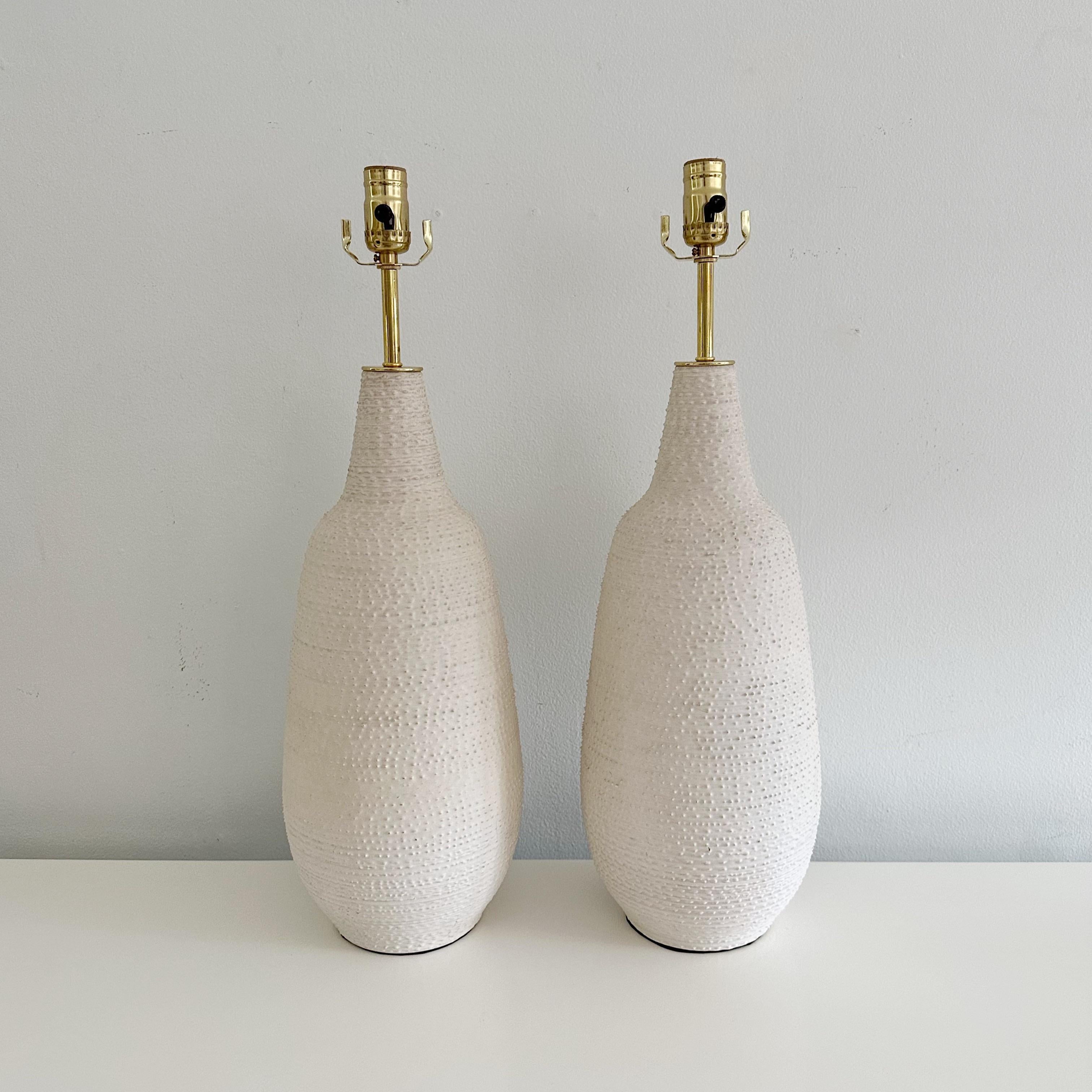Pair of studio pottery 1960's textured ceramic organic lamps, newly rewired with French silk twist taupe cords and solid brass fittings. Unsigned
