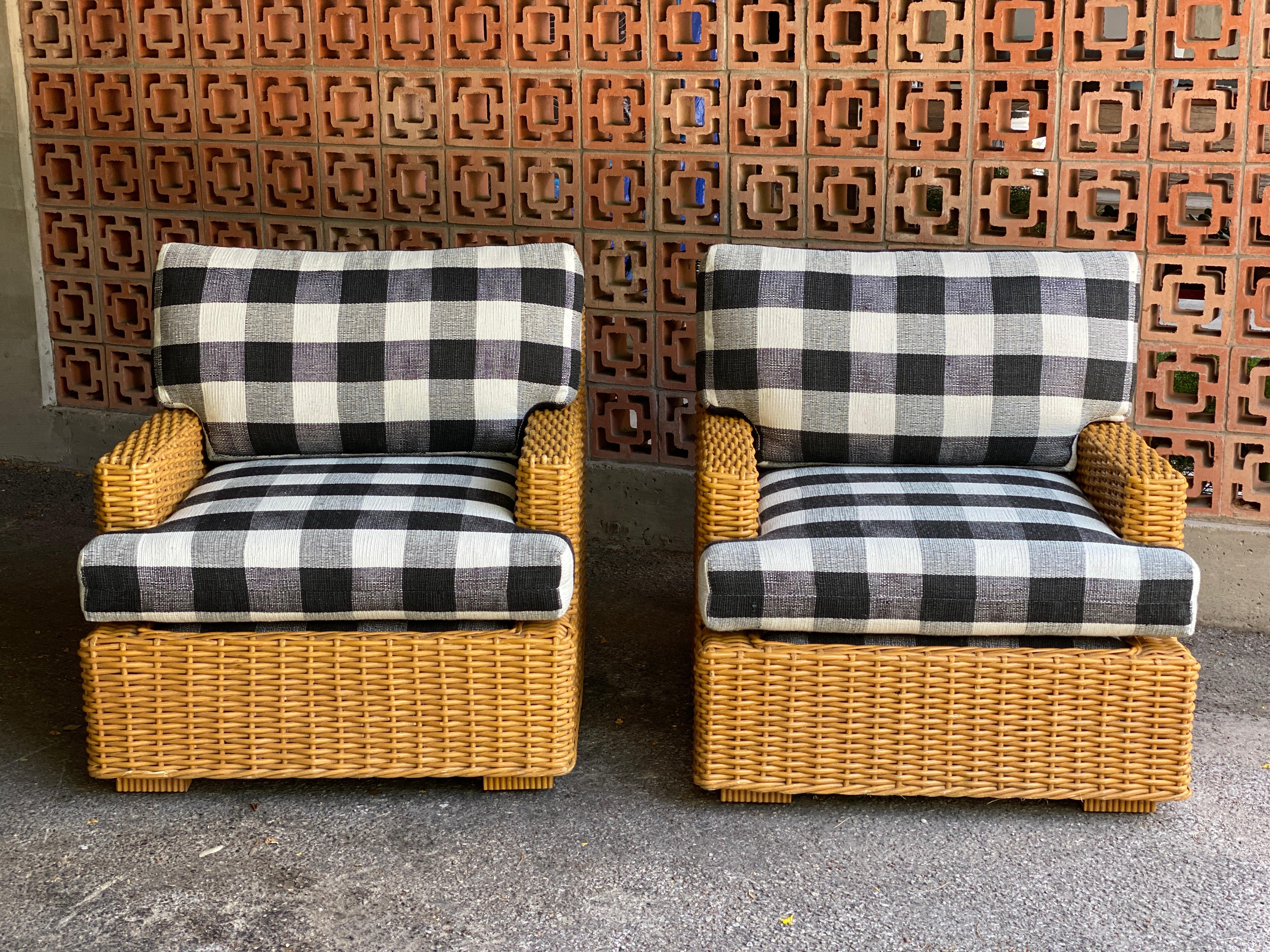 Vintage wicker lounge chairs with newly upholstered seat and back cushions in custom, Schumacher black and white check fabric (Barnes Performance Check / Black #77552). Very comfortable and smart looking. 

Triangular side table in pictures also