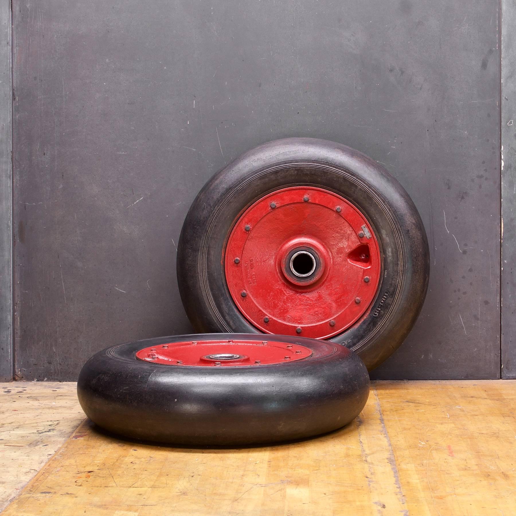 Strewn some midcentury red and black throughout your interior, they are holding air, great props! 

Measures: D 27 x D 7 inches.
 