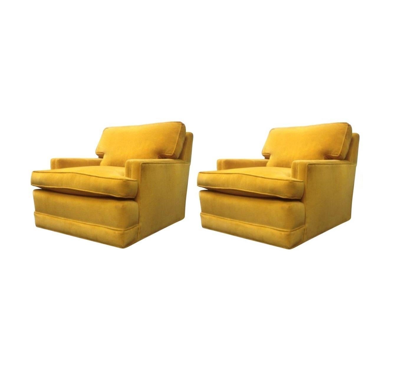 Pair of vintage club lounge chairs in a stunning marigold citron yellow velvet. Upholstered ledge-back with loose seat and back cushions. These chairs are stylish and comfortable. These chairs will bring a brilliant pop of color to your room.