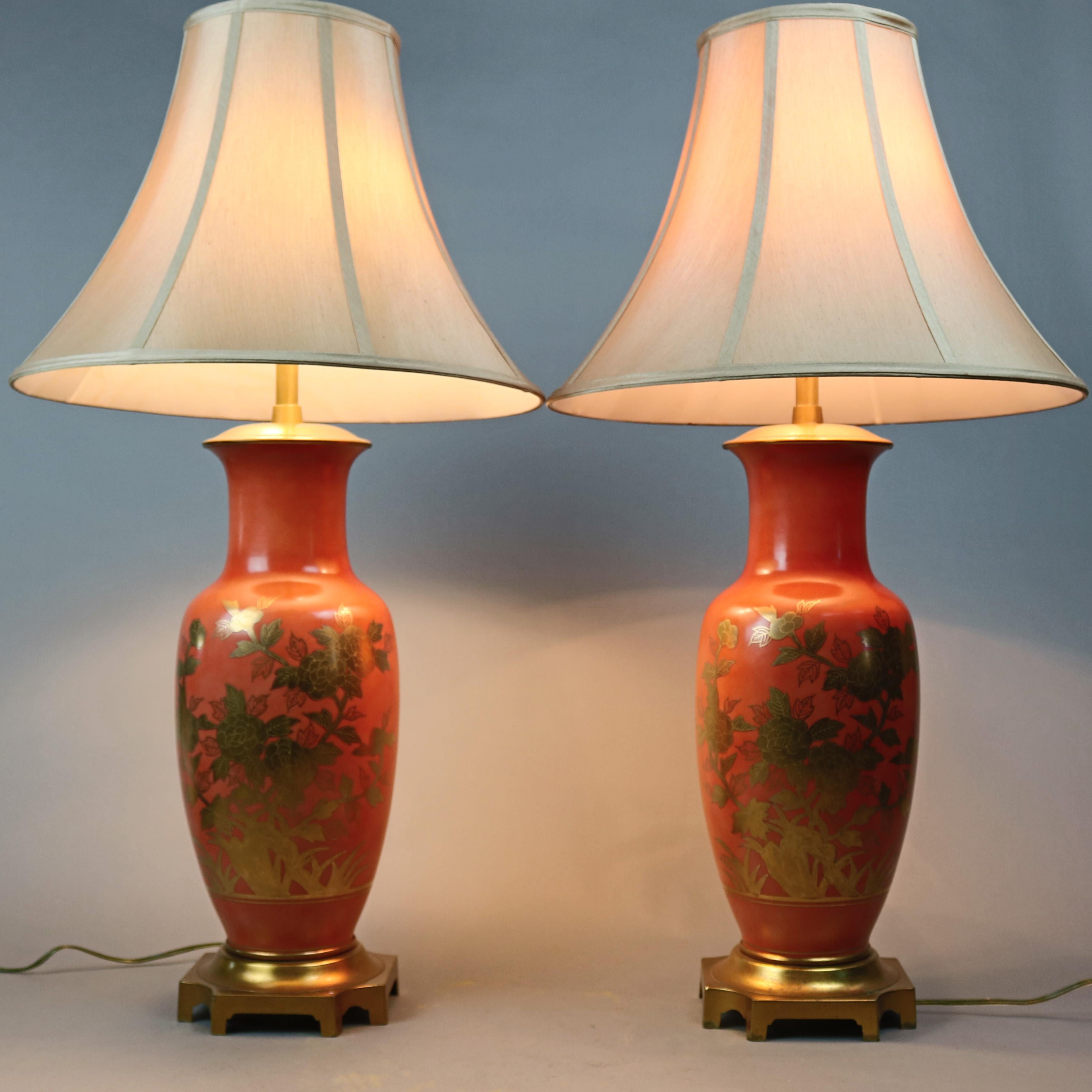 A vintage pair of Chinese double socket table lamps offer porcelain urn form base with gold gilt floral decoration, seated on gilt metal footed bases, 20th century

***DELIVERY NOTICE – Due to COVID-19 we have employed LIMITED-TO-NO-CONTACT