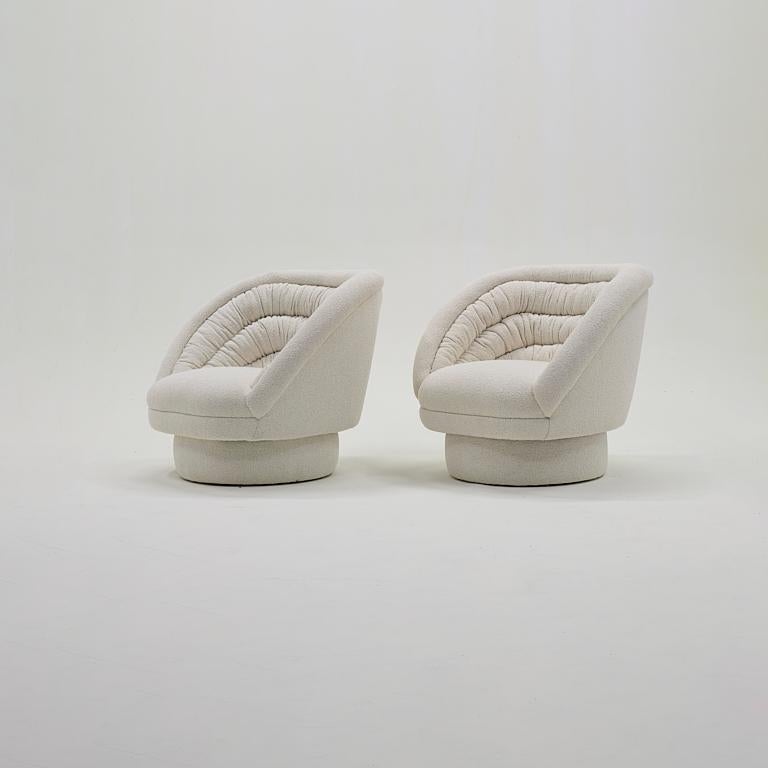 Beautiful pair of Vladimir Kagan Crescent chairs.  Expertly reupholstered in off white boucle.  Super comfortable and ready to use.  Virtually no signs of wear.

literature: Vladimir Kagan Designs, Inc., manufacturer's catalog, unpaginated The