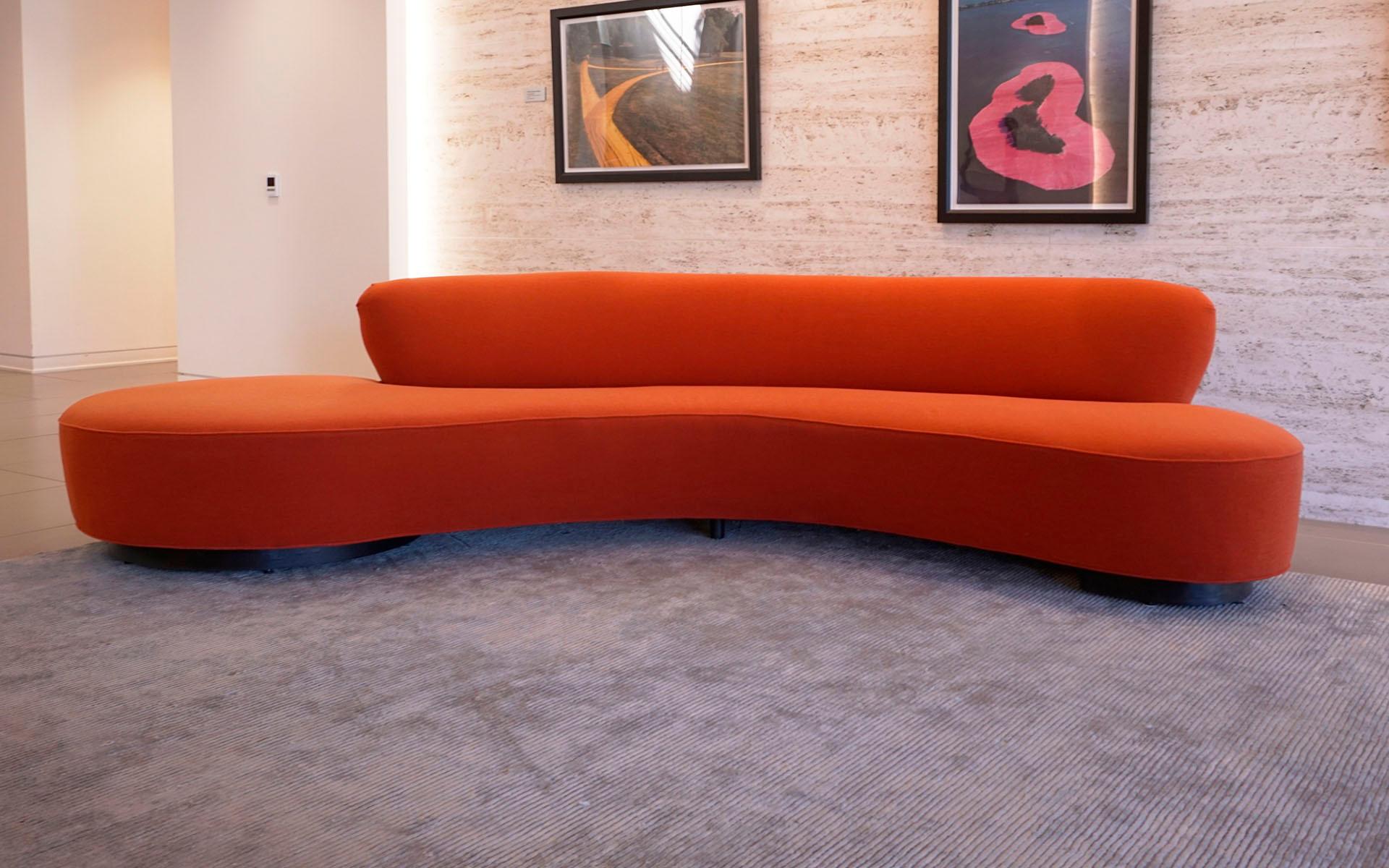 Two original Vladimir Kagan curved sofas in the original orange fabric in very good to excellent condition. Very few if any signs of use. These sofas are about 20 years old and were rarely used. Beautiful. Price is for each.