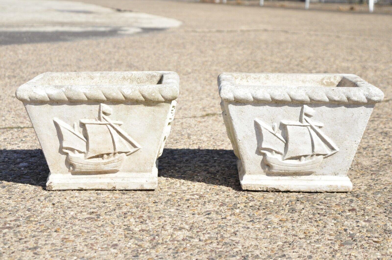 Pair of Vintage cast concrete garden planter box pots with ships and shield with lions. Item features clipper ships on two sides and Lion with shield on two sides, heavy cast cement construction, great style and form, approx. 45 lbs. Circa mid to